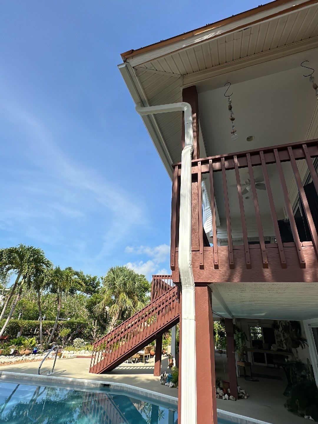 White K-Style Gutters Installed with White Downspouts in Sanibel FL by Gutter Professors