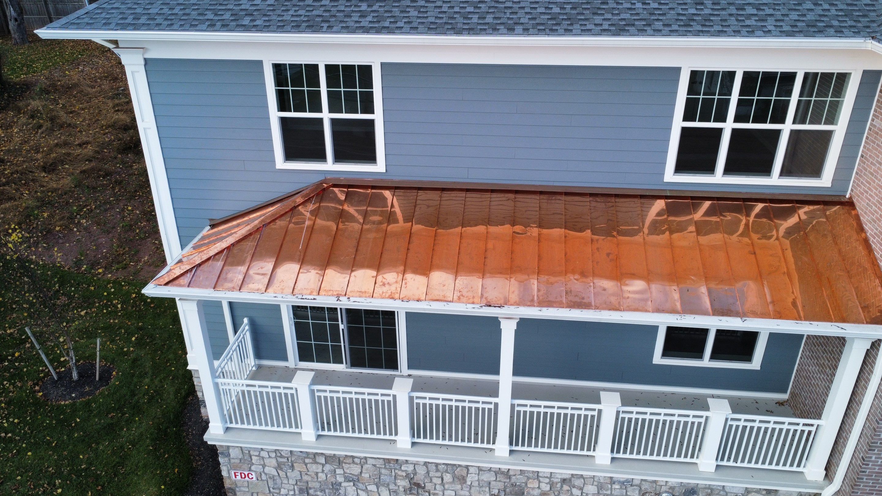 Standing Seam Metal Roof using Copper by CMNG LLC