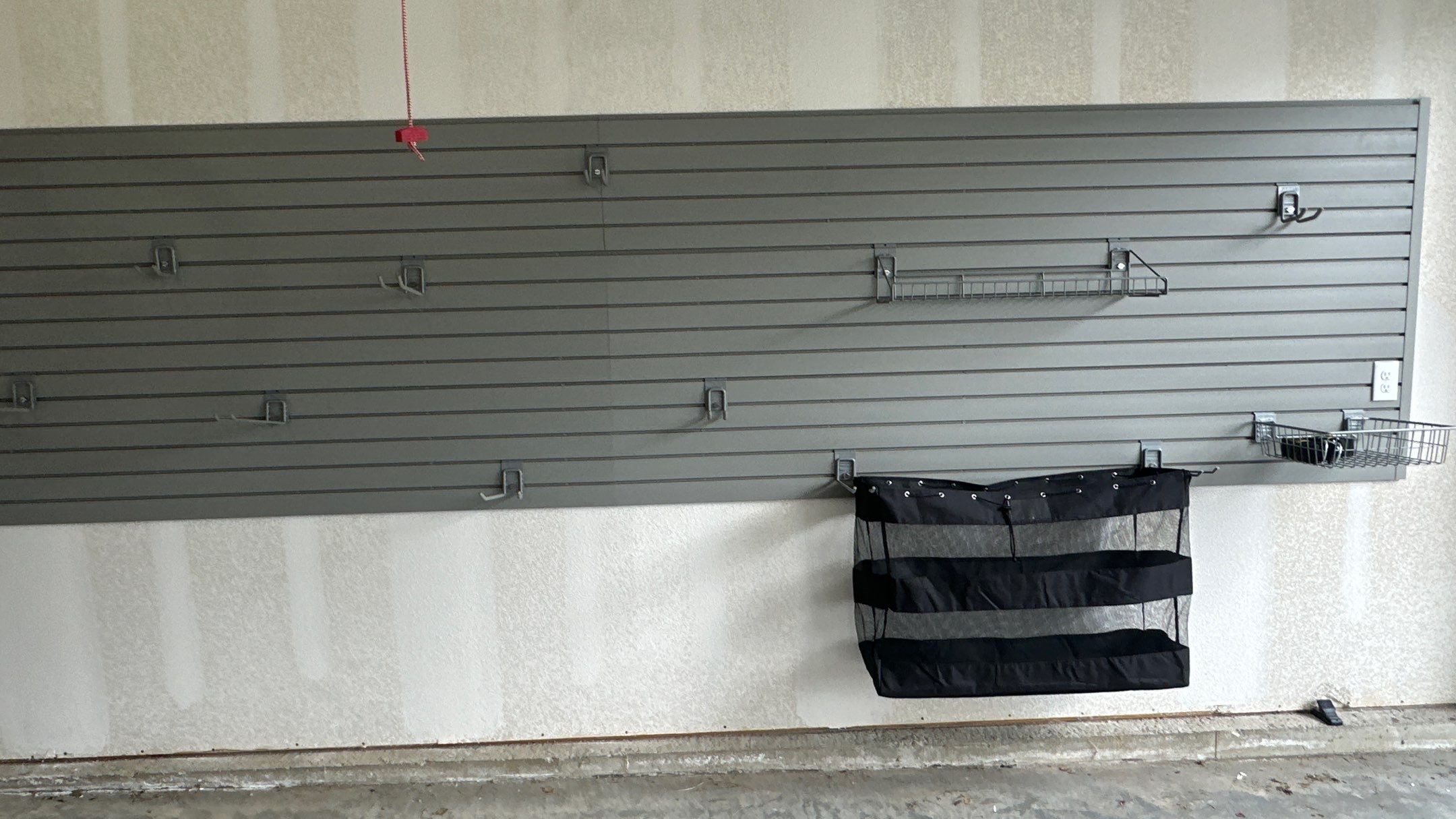 Jim H. added Slotwall and bike hoist to his garage by Banner Garage