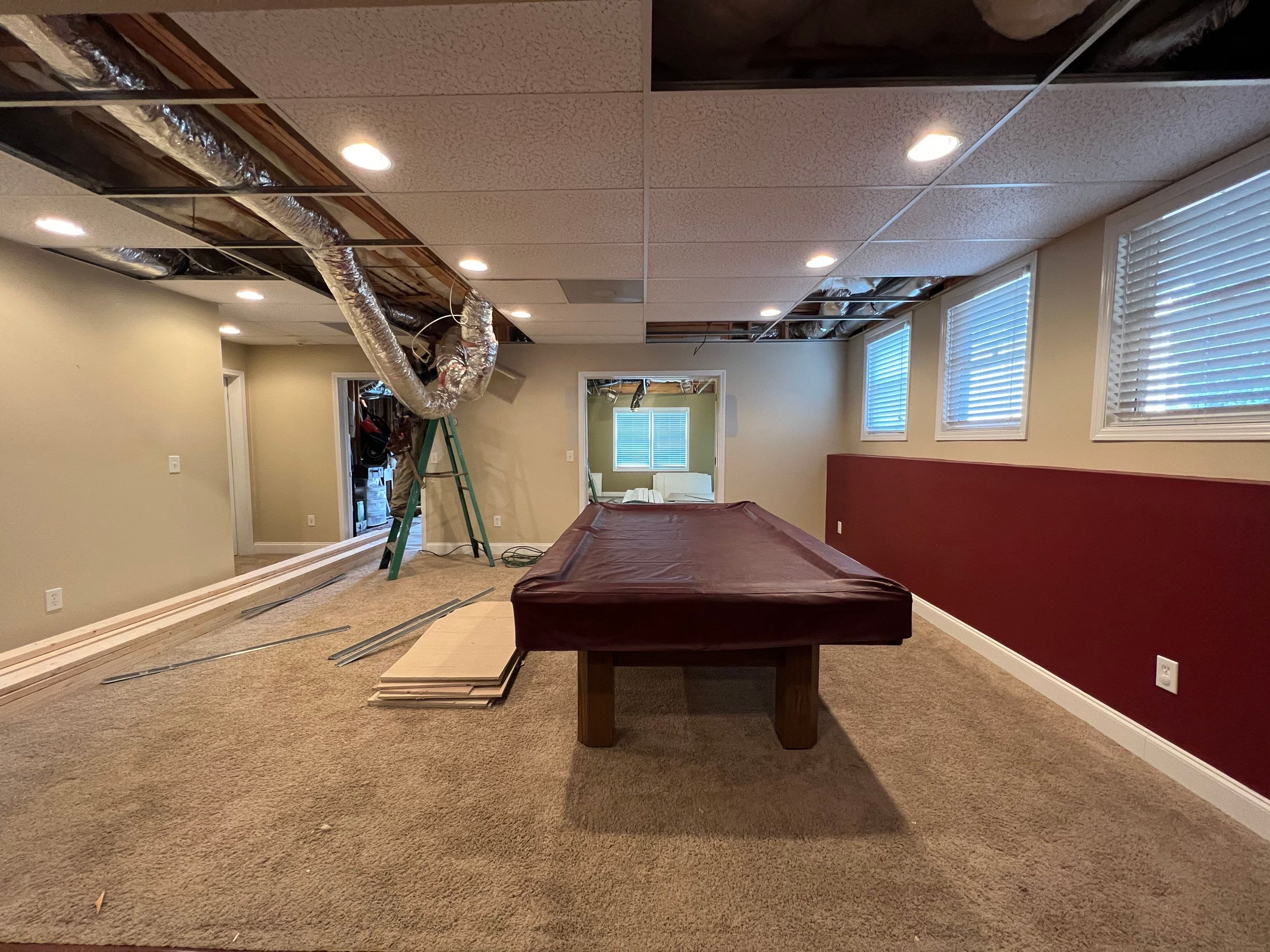 Modern Basement Remodeling in Woodstock with Custom Live-Edge Bar by Swift Home Renovations