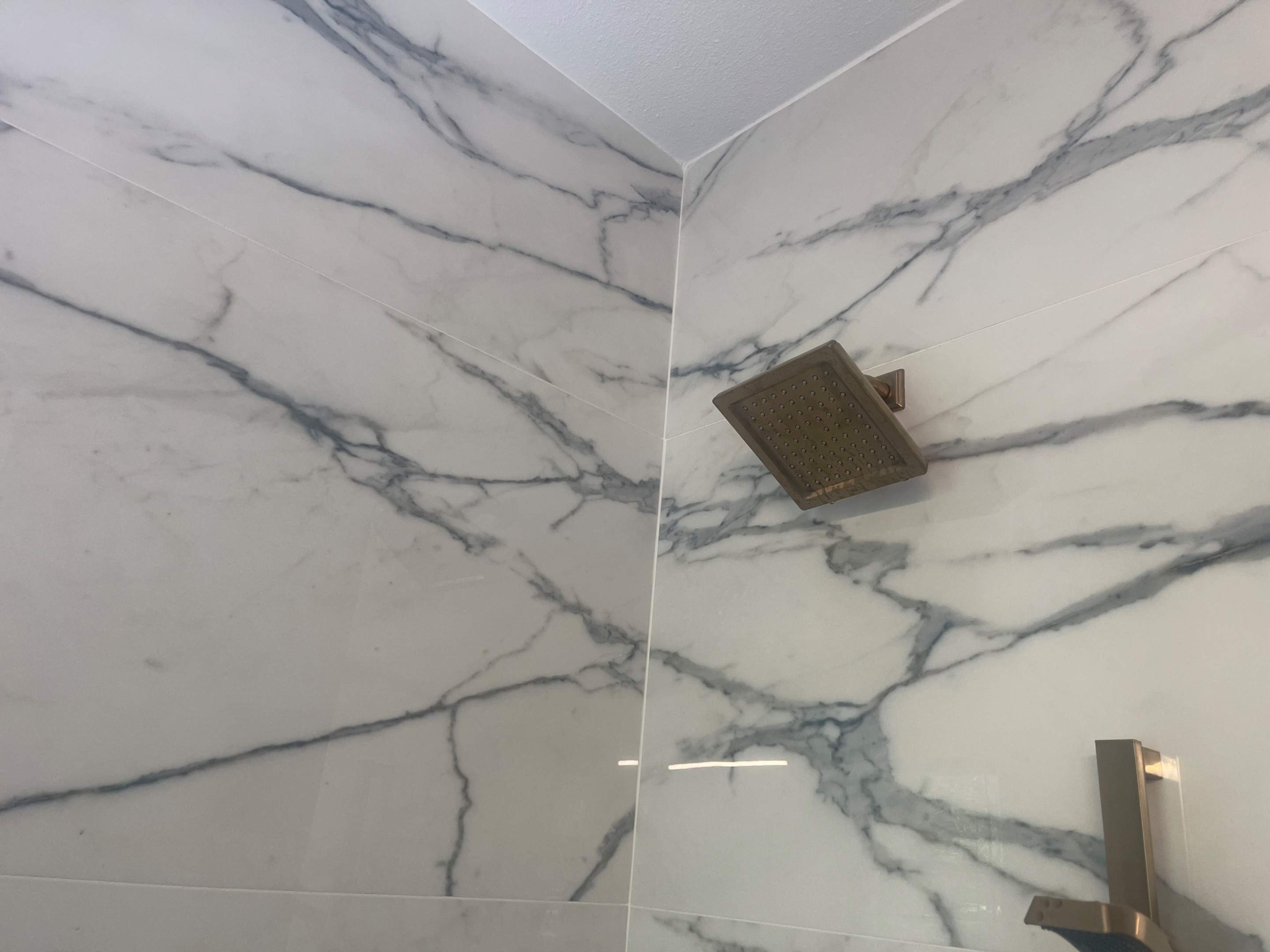 San Antonio Kitchen and Bathroom Remodel Featuring Marble-Patterned Tiles by Mena stone surfaces