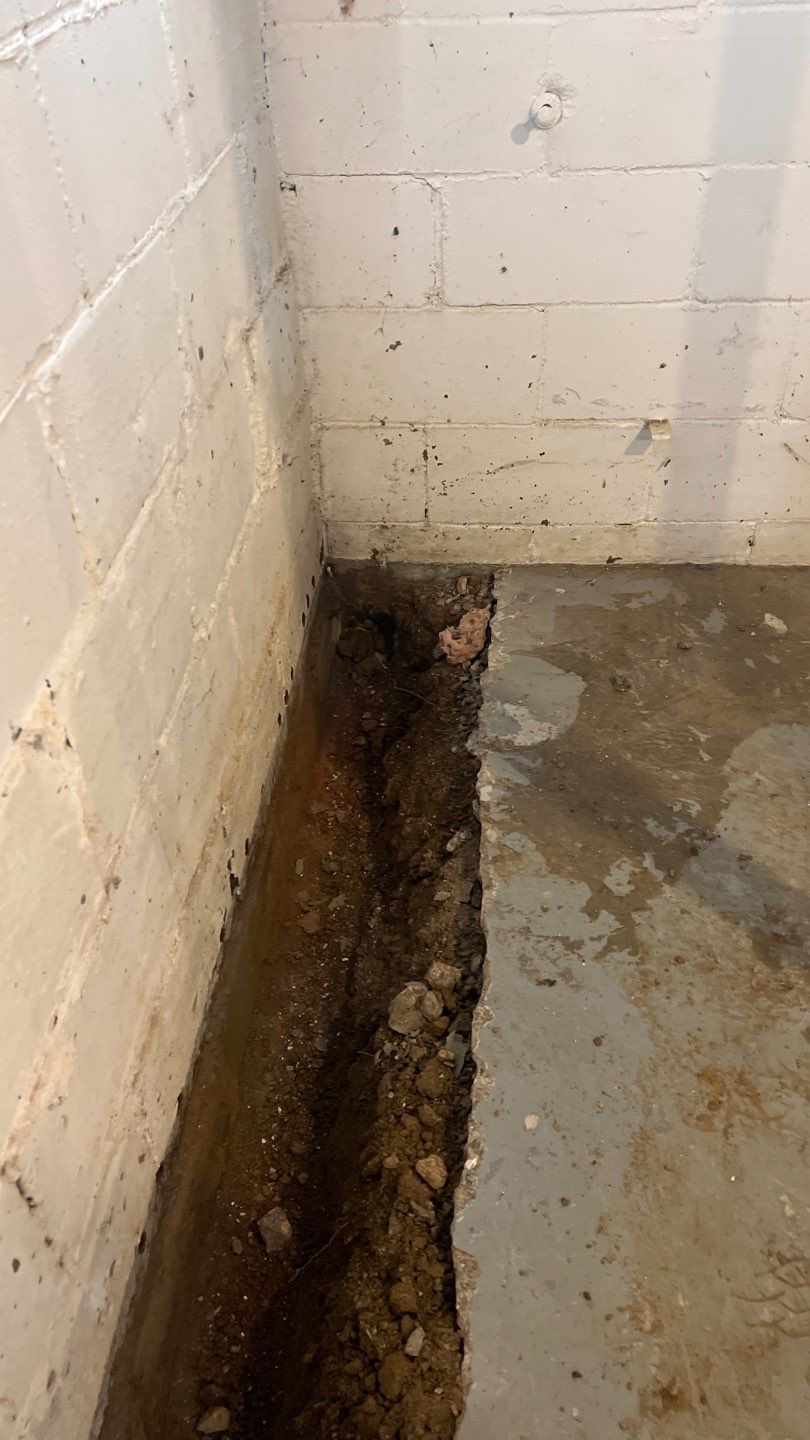 Basement Waterproofing using Drain tile system and a foundation wrap by ACE Waterproofing & Basement Solutions