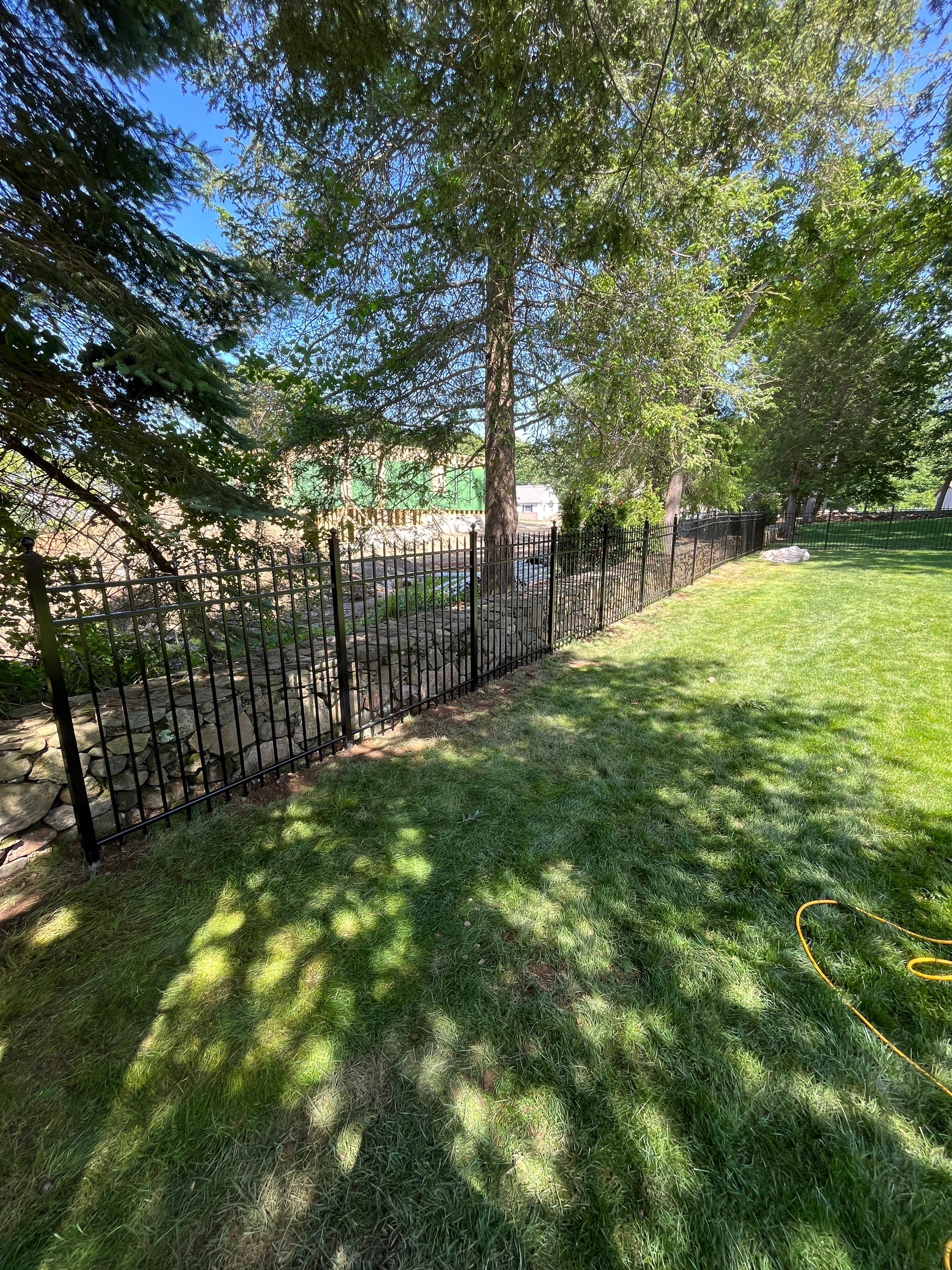 New Black Aluminum fence with matching gate by DiGiorgi Roofing and Siding Inc