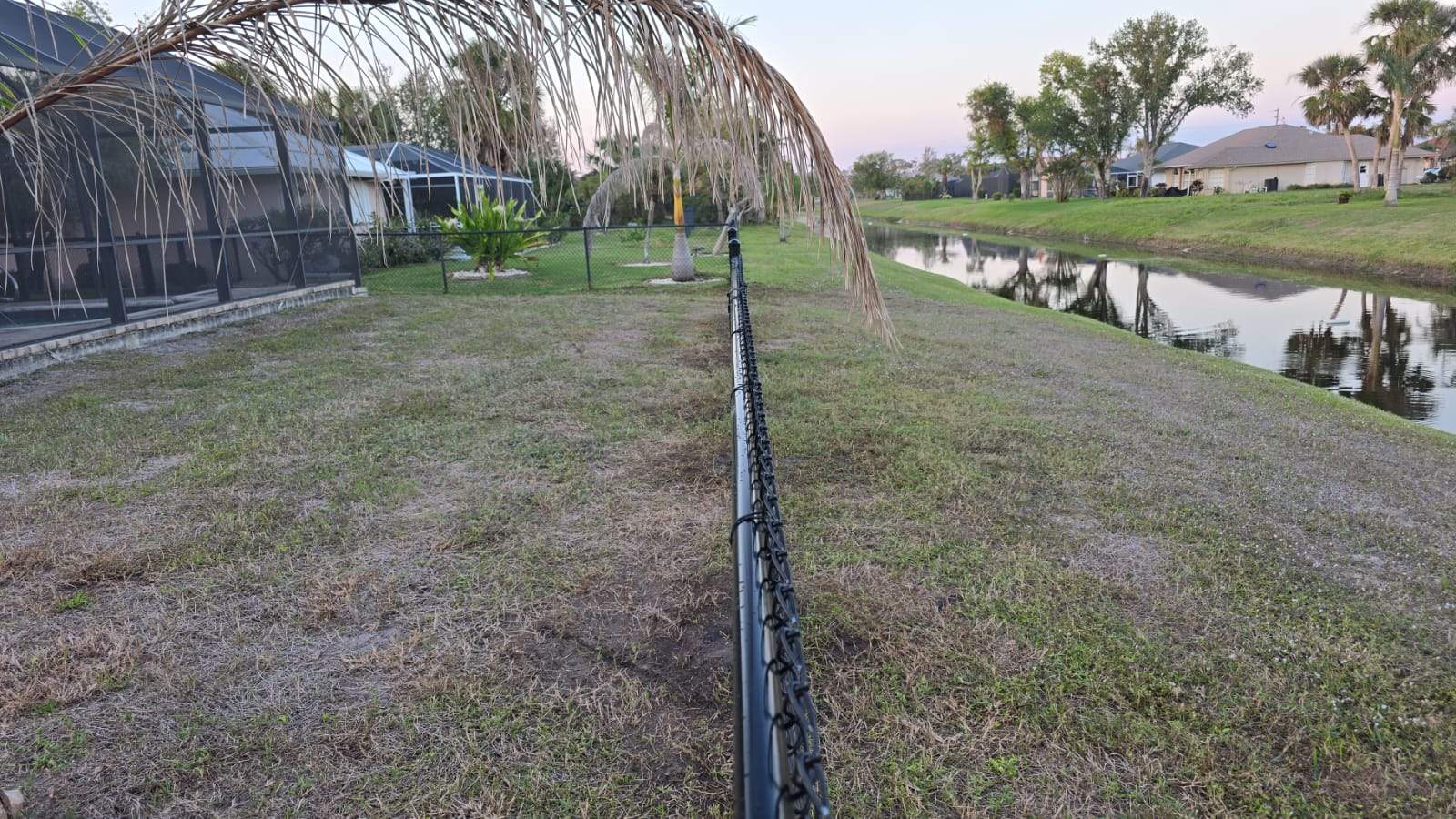 Waterfront Black Chain Link Fence Installation in Rotonda West by True Fence LLC