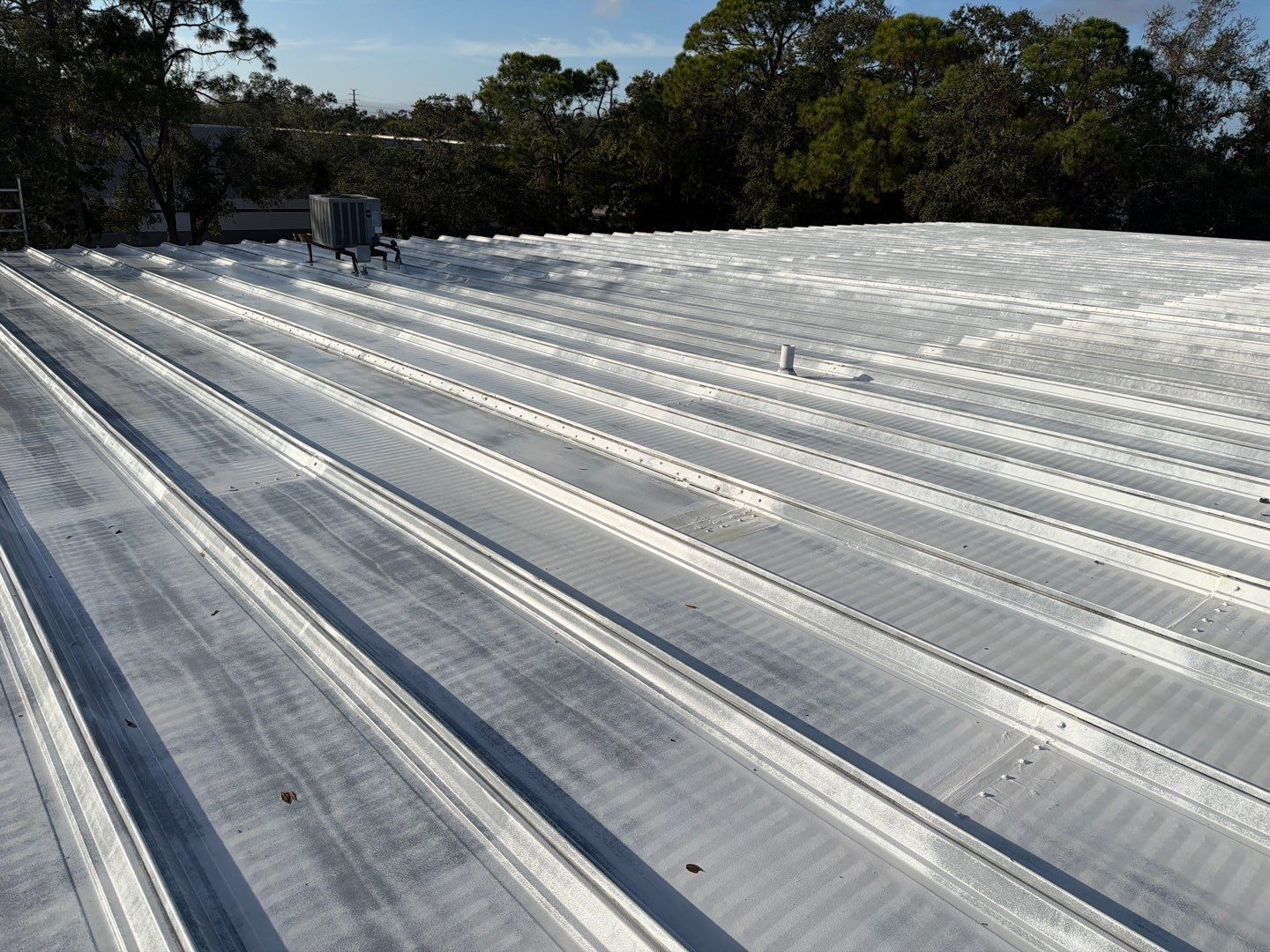 Sarasota Industrial Warehouse Metal Roof Silicone Coating Restoration by CES Roofing