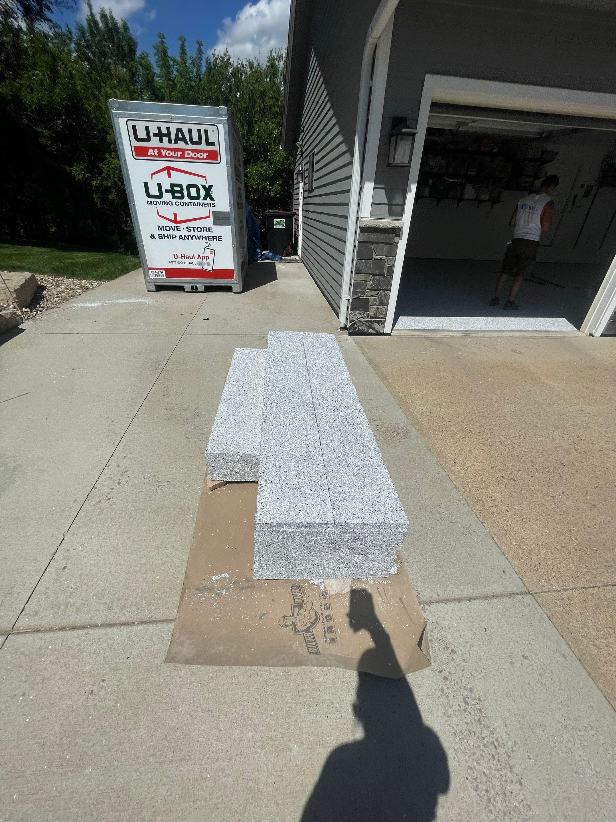 Feather Grey Garage Floor Coating Installation in Sioux Falls by Select Painting, Coatings & Garage Cabinets