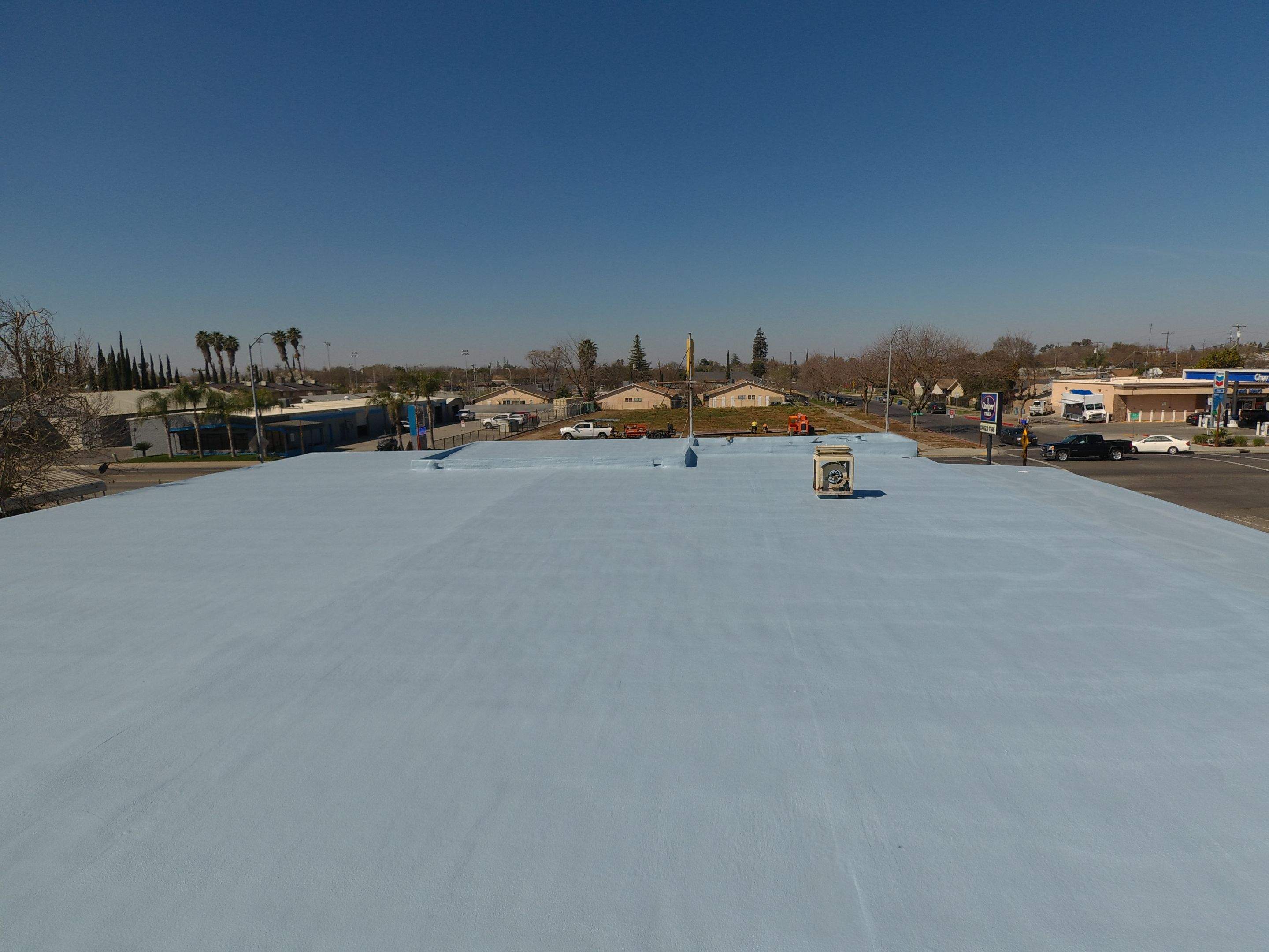 Spray foam and coatings using Conklin Benchmark/PUMA XL coatings and spray foam by Straight Edge Roofing Inc
