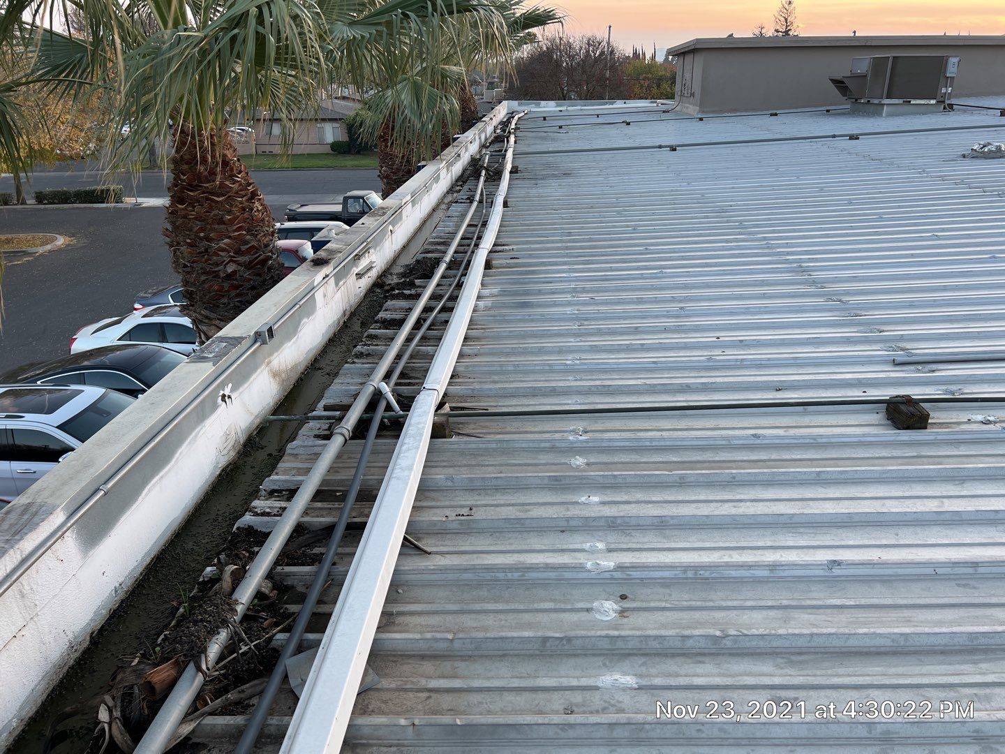 Metal roof restoration on commercial roof using Conklin Benchmark/ PUMA XL acrylic coatings over metal and foam by Straight Edge Roofing Inc