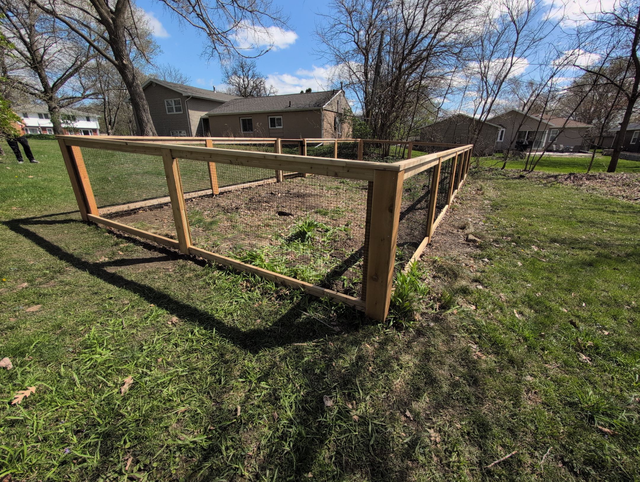 Custom Cedar Wood Garden Fence Installation in Cedar Falls by Perfect Picket Fence and Stain