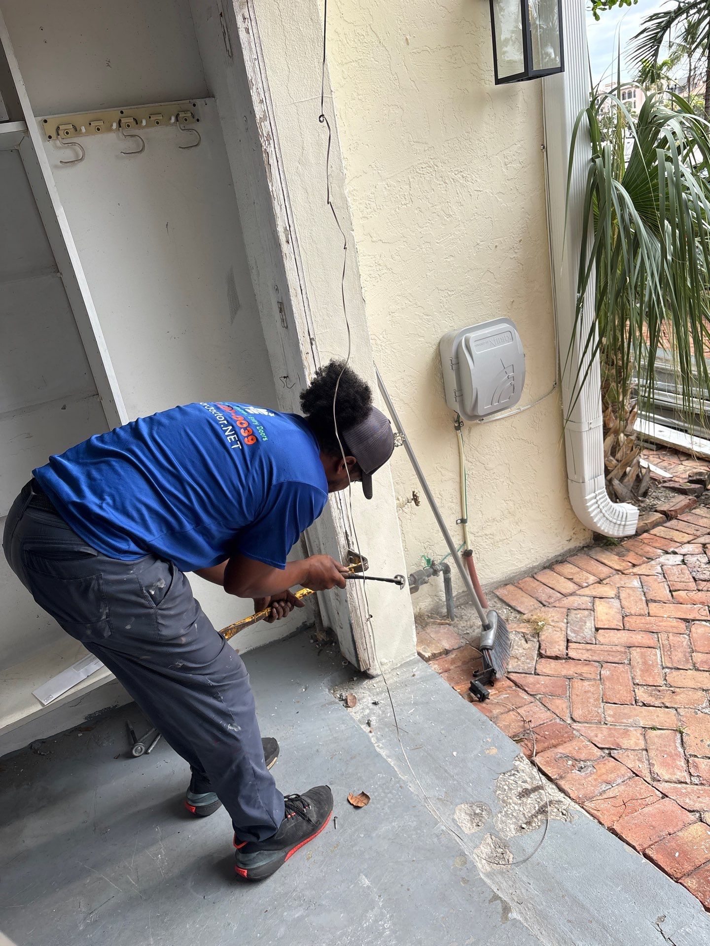 Modern Horizontal Wood Garage Door Installation in Fort Lauderdale by The Door Doctor of South Florida, Inc.