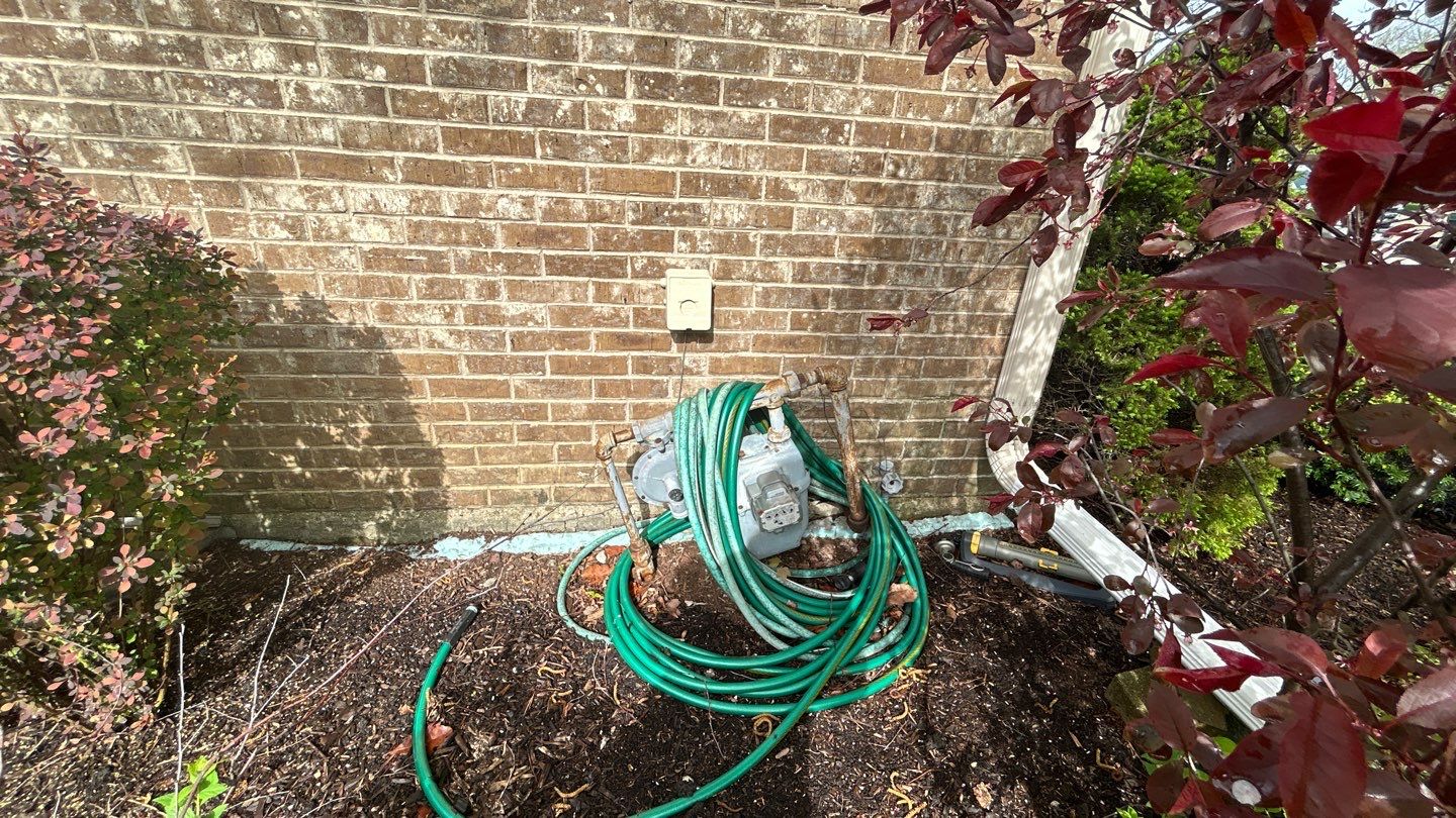 concrete patio and driveway cleaning by Northern Power Washing LLC.