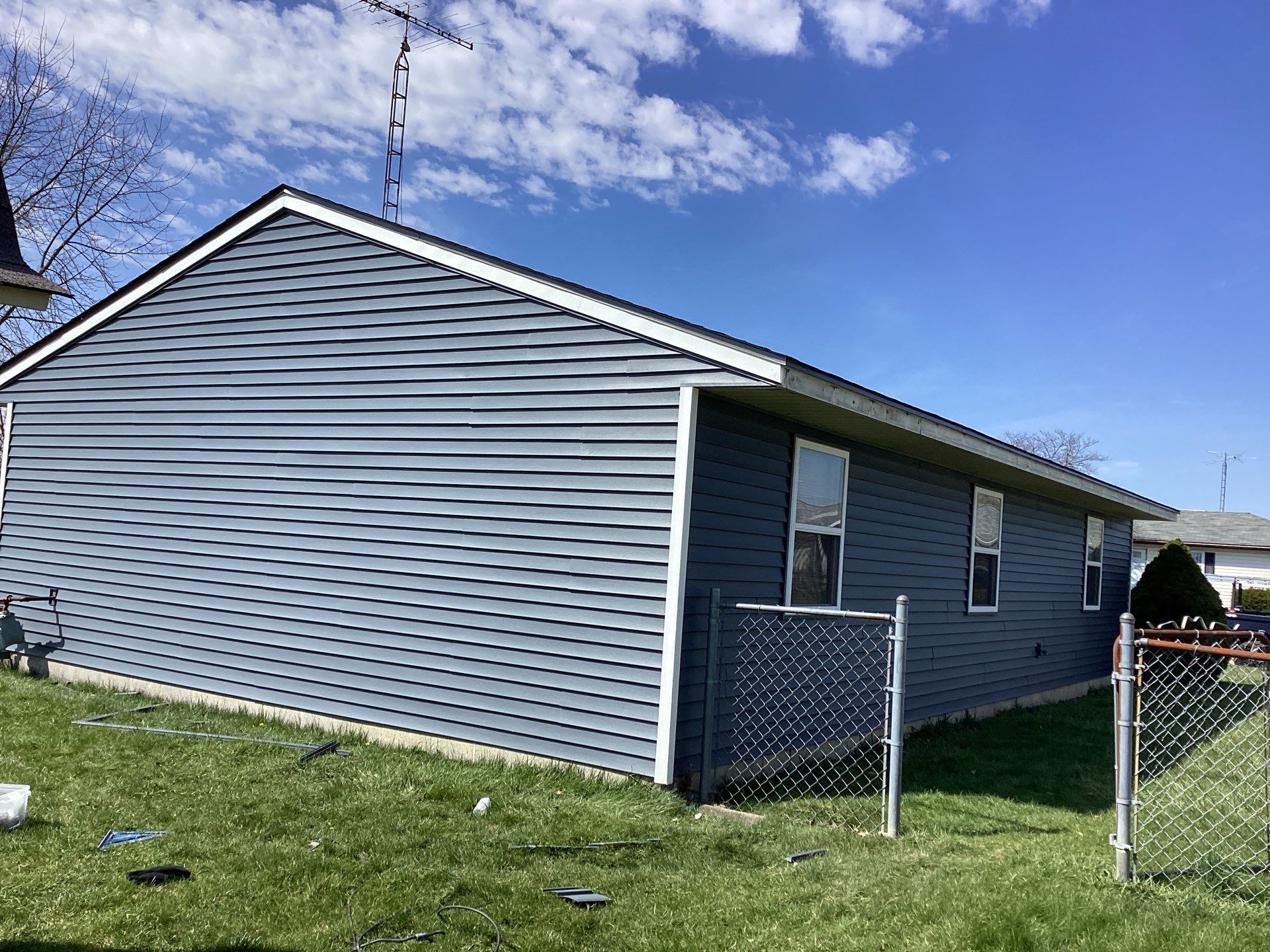 Storm Damage Residential Roof and Siding Installation by WIW Enterprises Inc