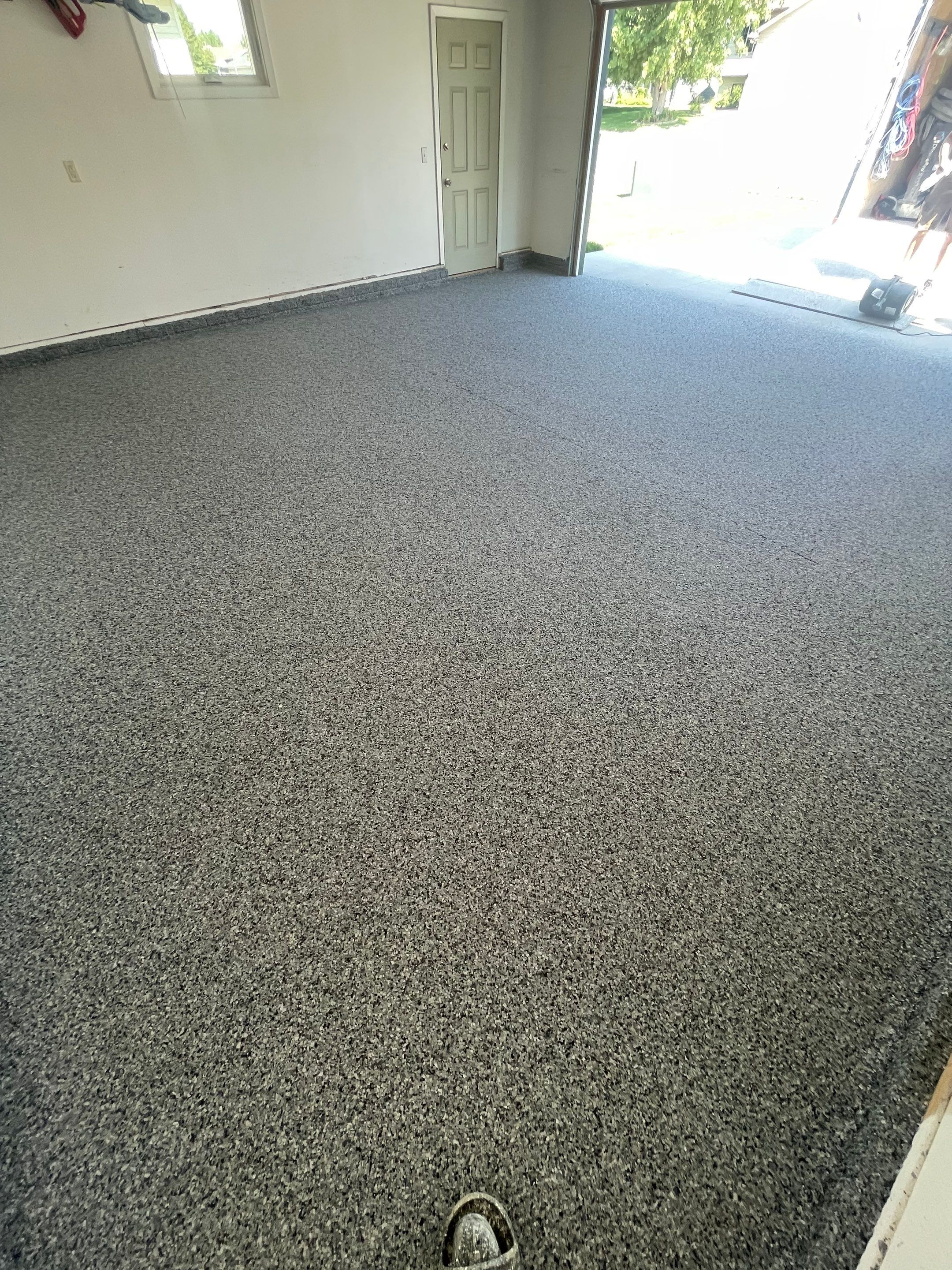 Sioux Falls Garage Floor Coating with Nightfall Decorative Chips by Select Painting, Coatings & Garage Cabinets