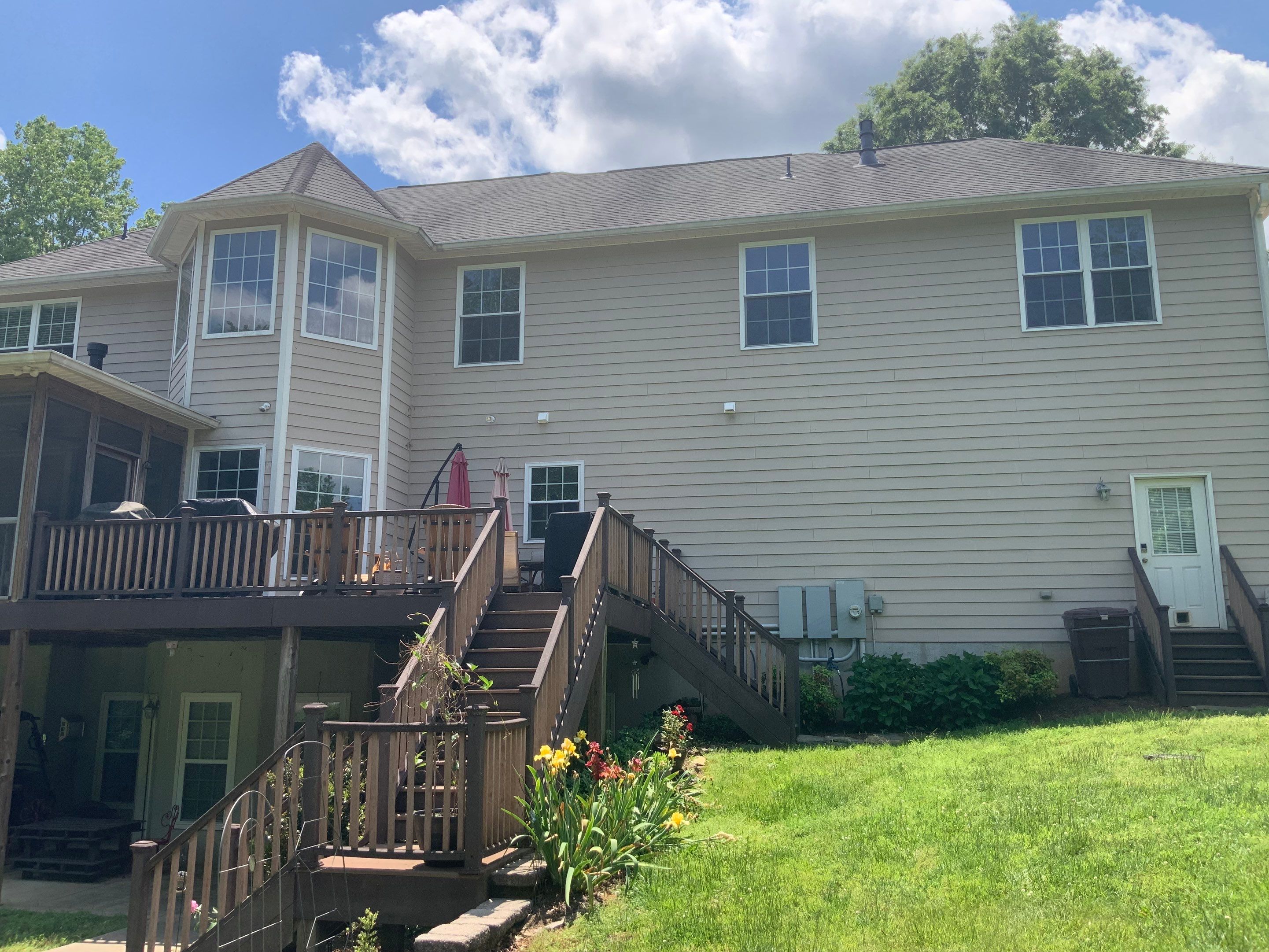 Siding replacement, exterior painting, and front door staining. by GonzalezPainters & Contractors Inc