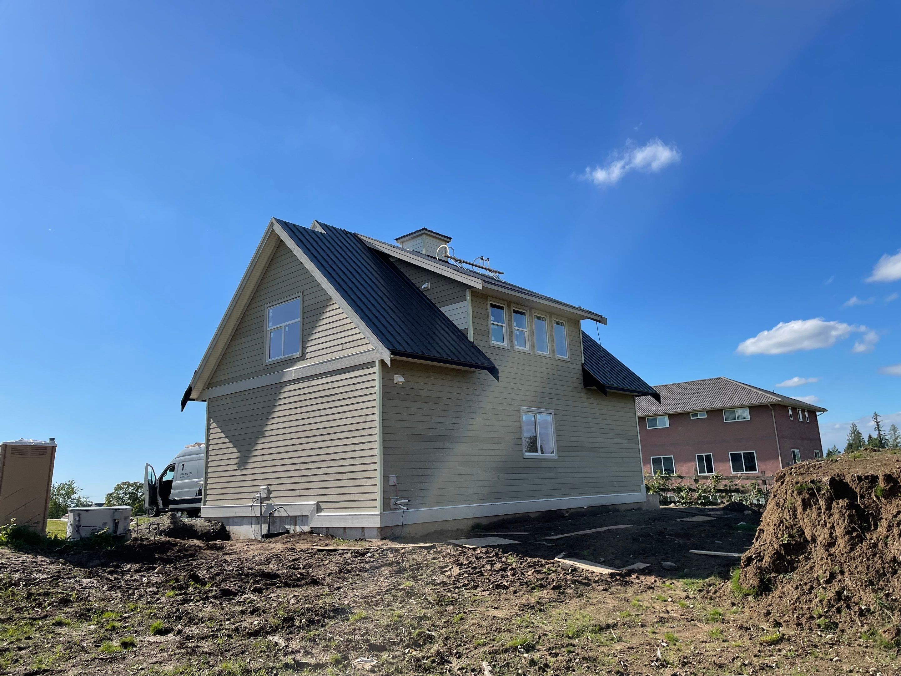 Residential Roofing Installation using 12" Prolok metal  by Top Notch Roofing Inc
