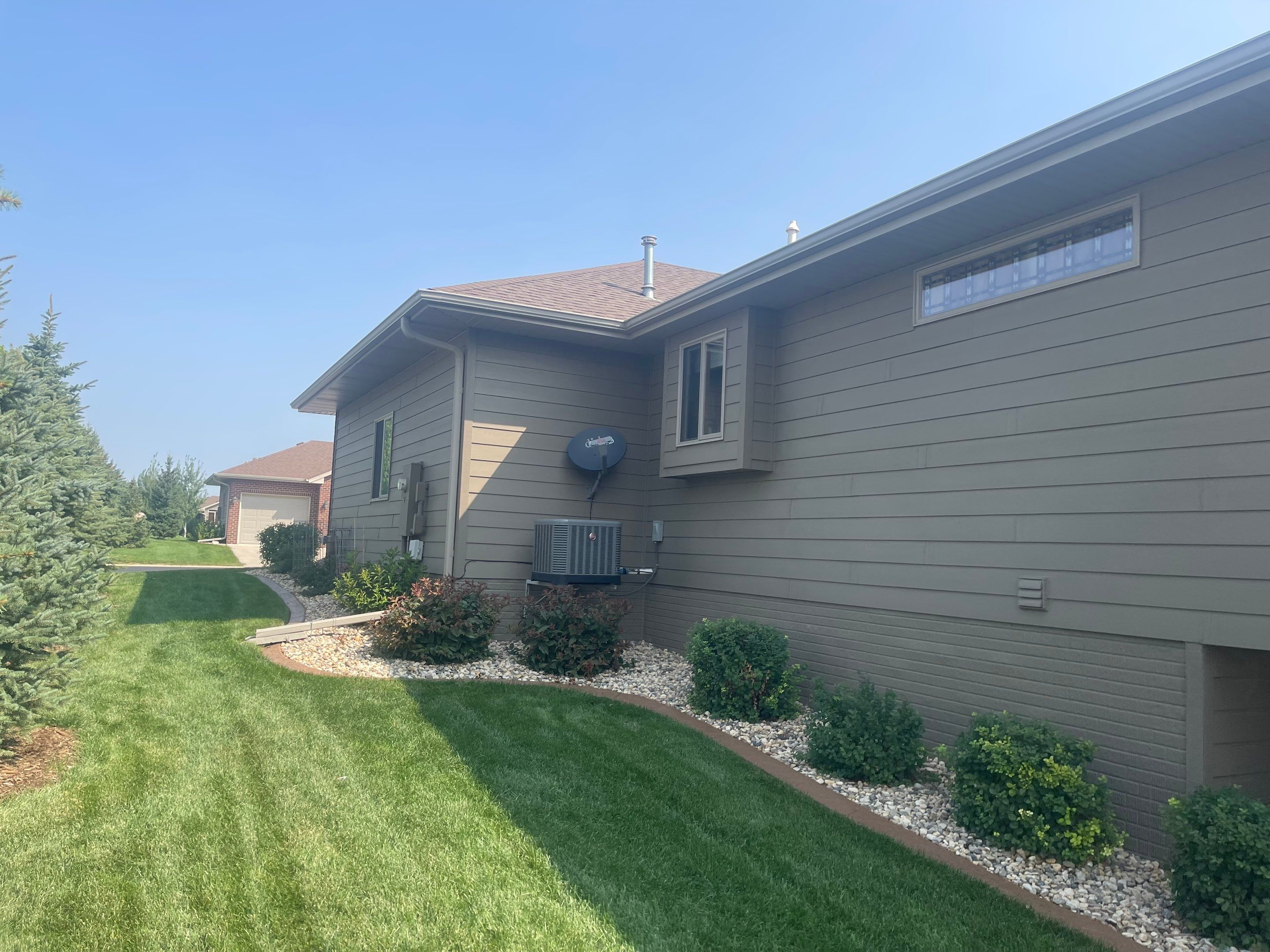 Residential Exterior Siding and Trim Painting in Sioux Falls by Select Painting, Coatings & Garage Cabinets