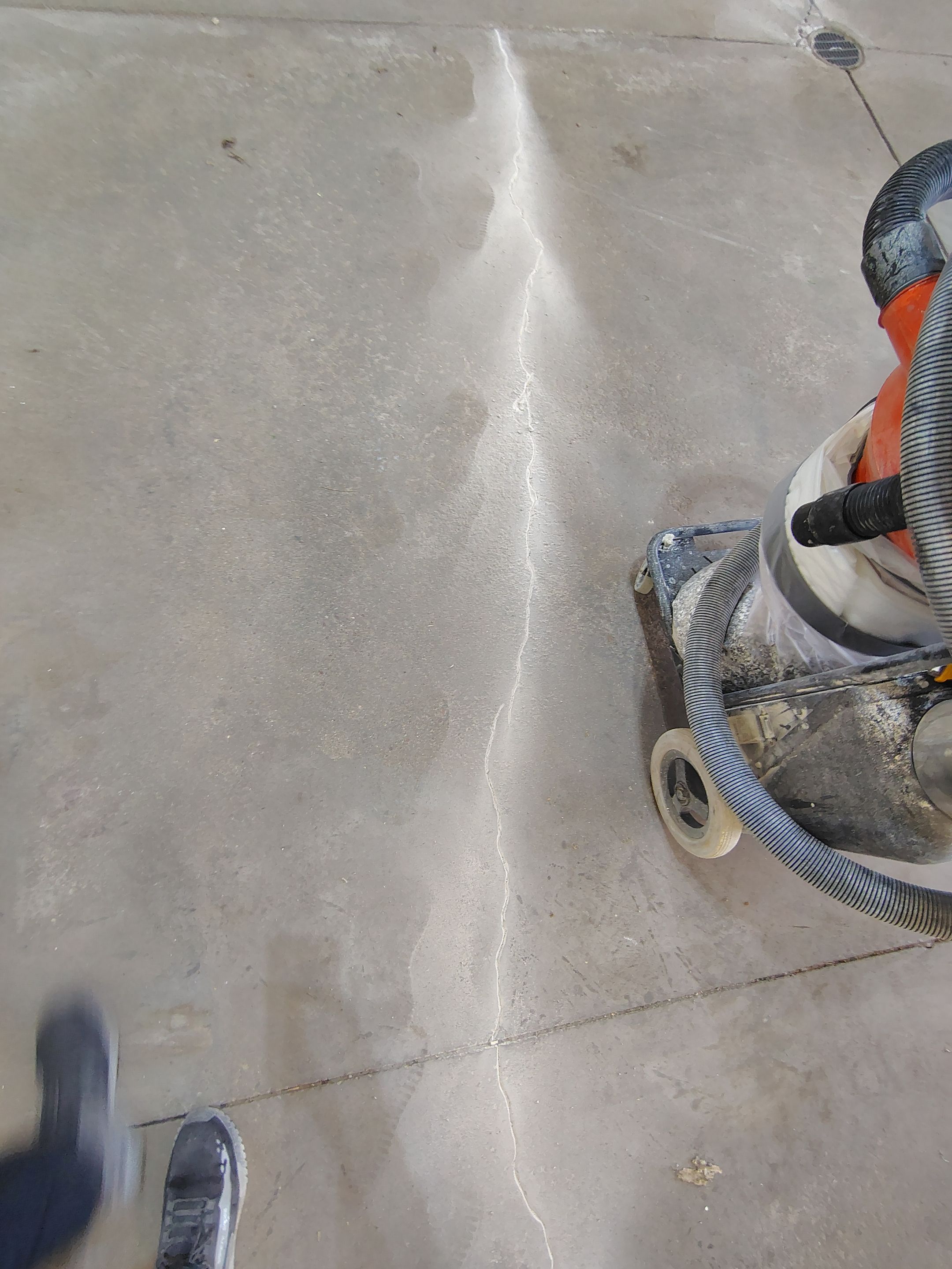Sioux Falls Garage Floor Repair and Speckled Epoxy Coating Installation by Select Painting, Coatings & Garage Cabinets