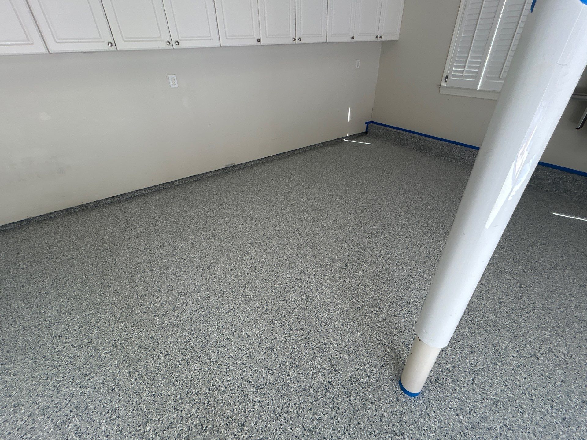 Concrete Floor Coating Transformation by DiGiorgi Roofing and Siding Inc