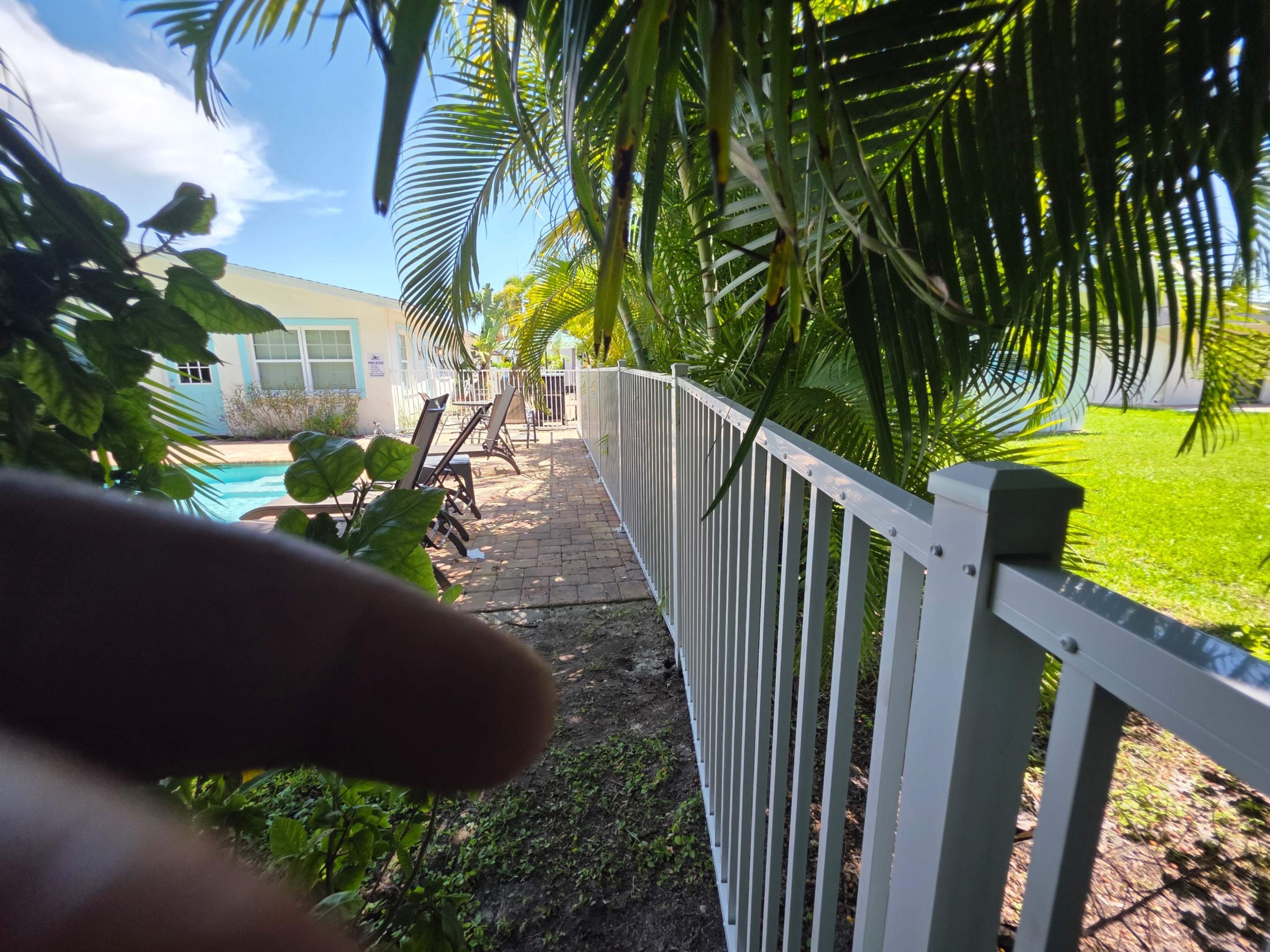 Commercial White Aluminum Pool Fence Installation in Naples by True Fence LLC