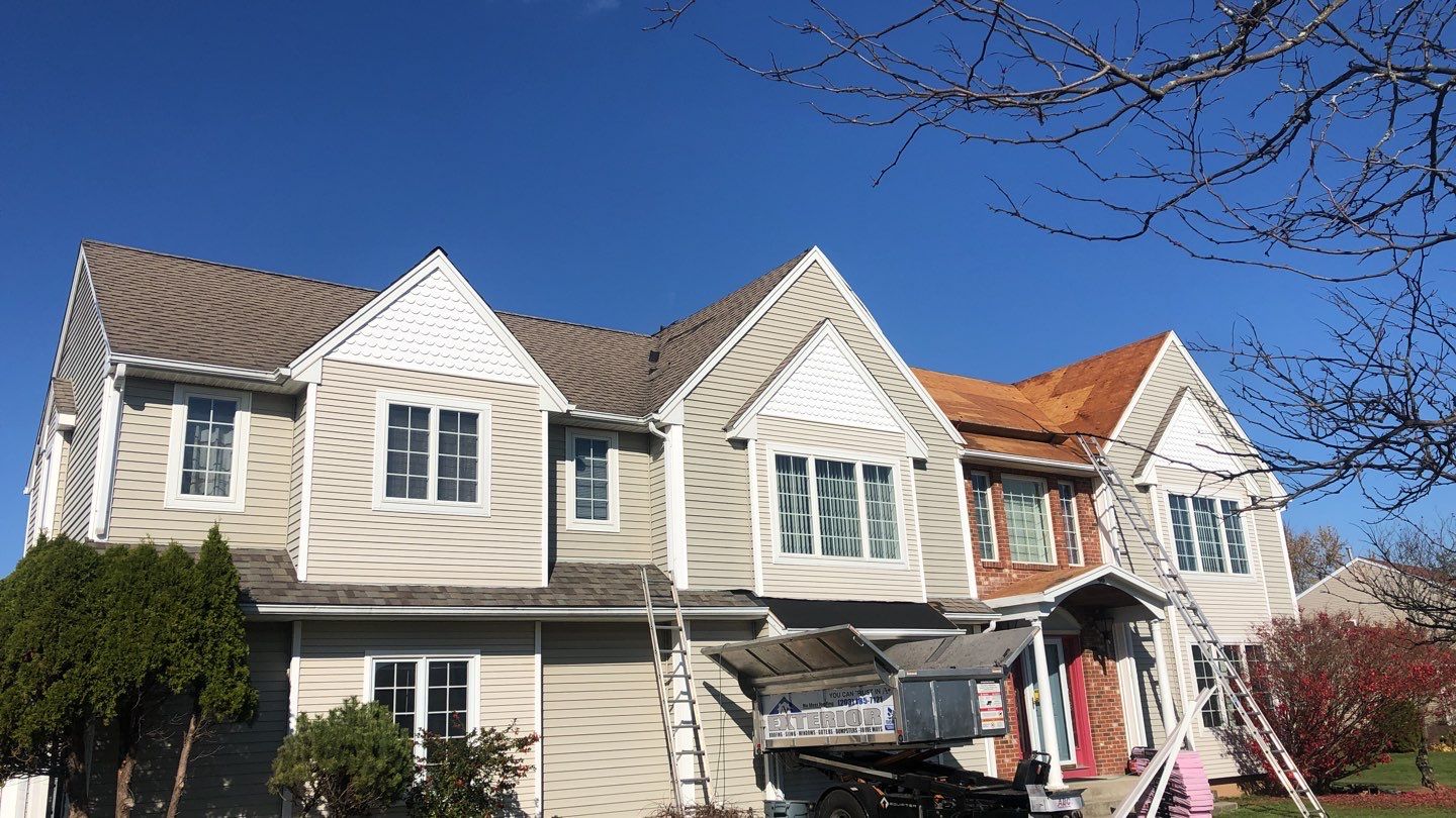Commercial Roofing Installation using Owens Corning TruDefinition driftwood by A Plus Exterior