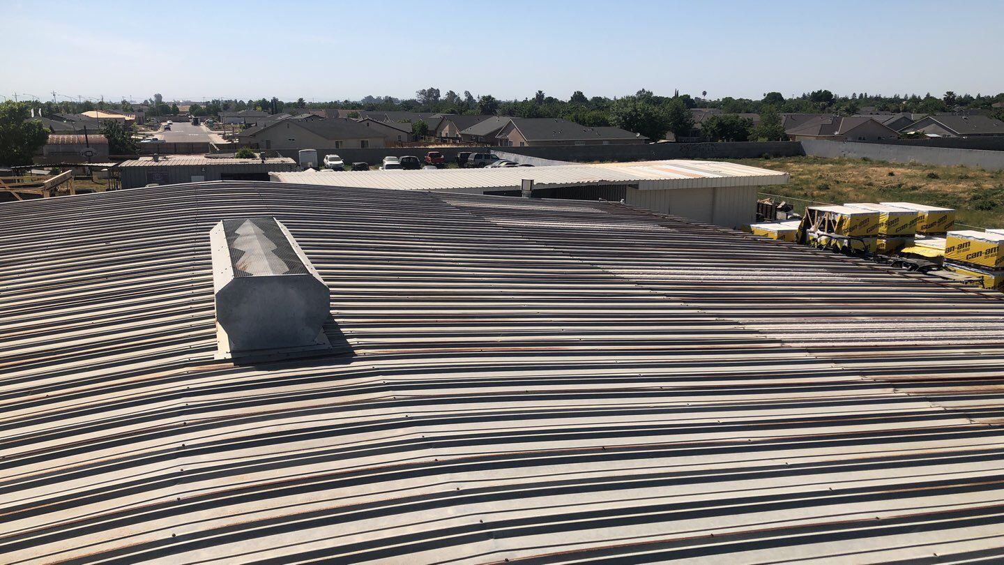 Metal Restoration Roofing system with Benchmark/PUMA XL 20 yr warranty by Straight Edge Roofing Inc