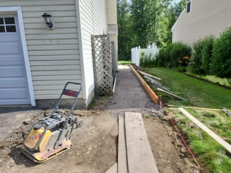 Stamped Concrete, Entry Door, and Concrete  by Ivy Lea Construction