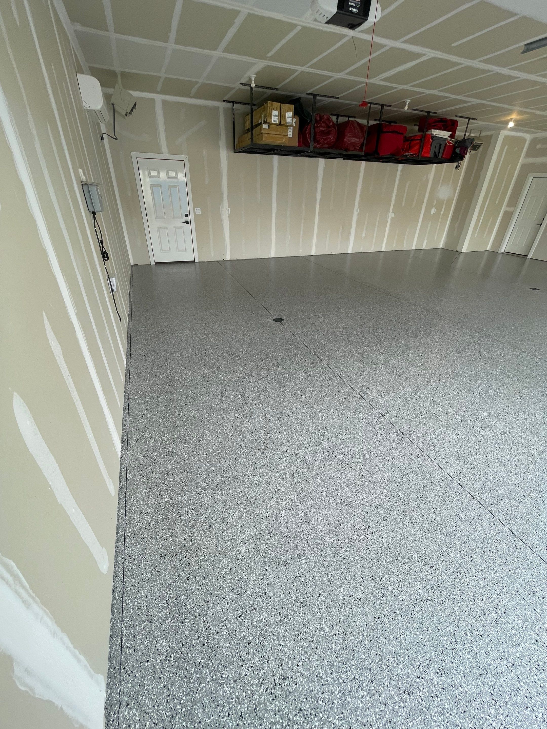 Grey Speckled Epoxy Floor Coating for Sioux Falls Garage by Select Painting, Coatings & Garage Cabinets