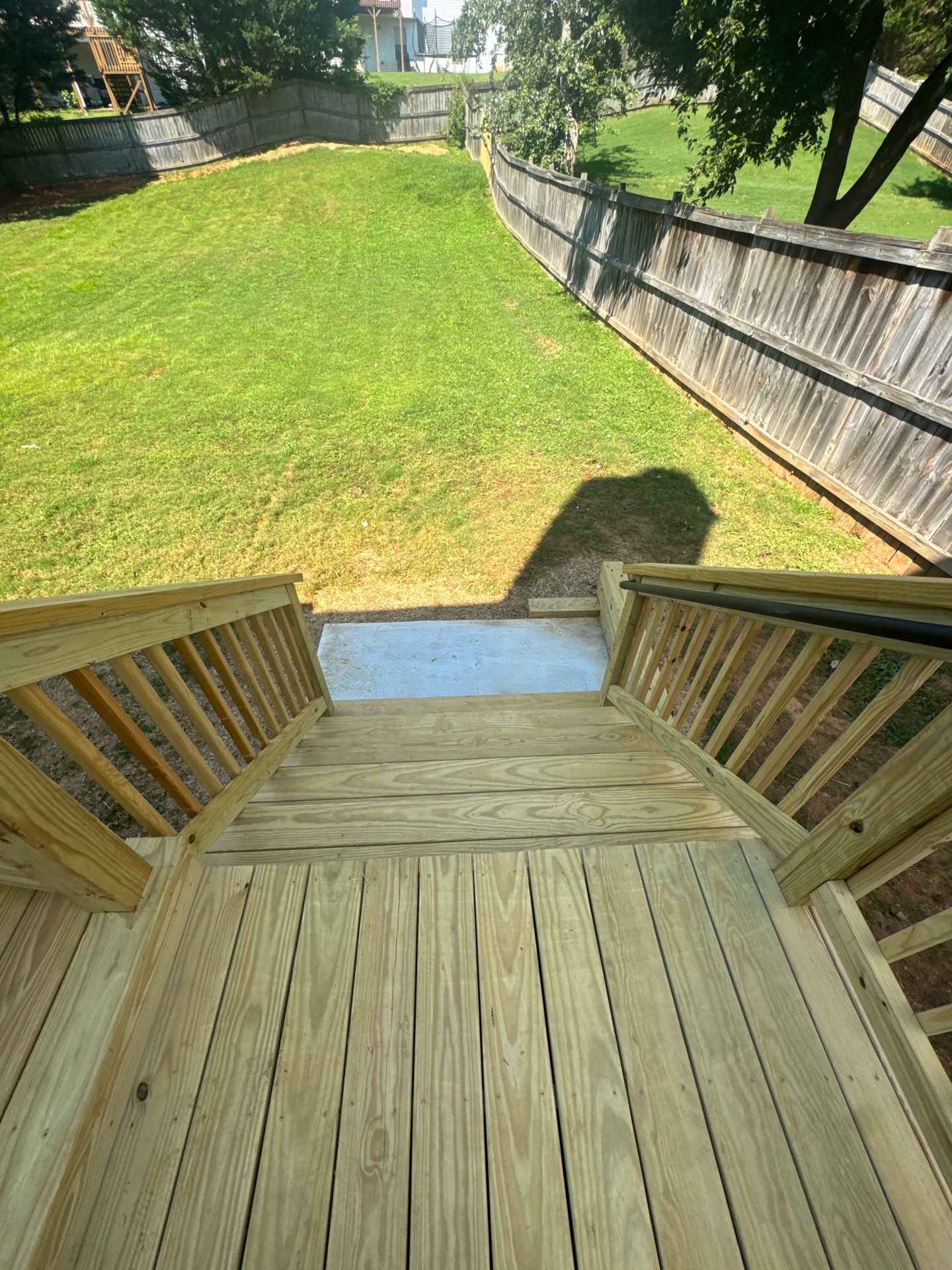 Backyard Deck Expansion & Custom Staircase Installation in Suwanee. by Swift Home Renovations