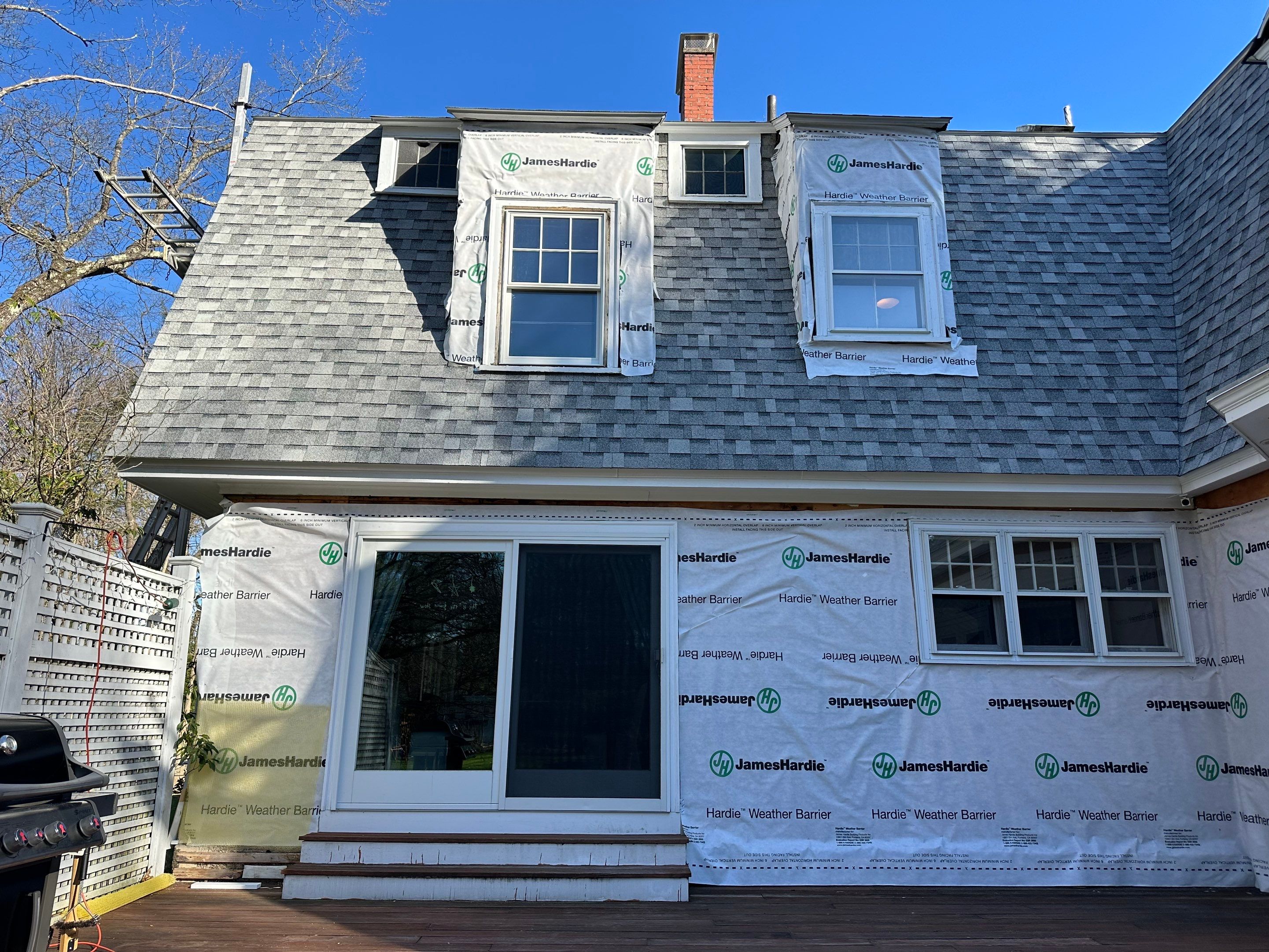 White cedar shingles and windows in Wayland, MA by UBrothers Construction