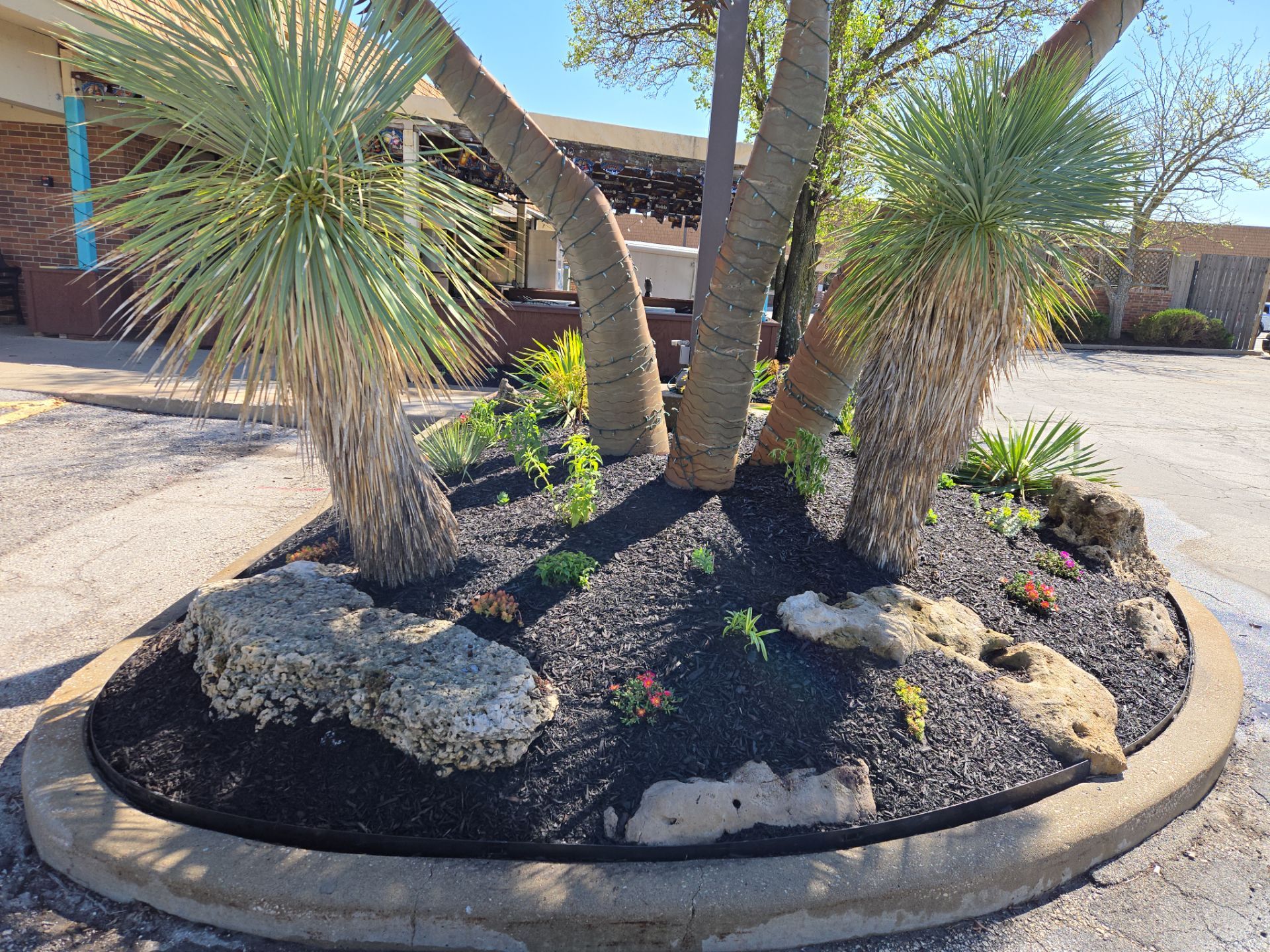 Restuarant Landscape Installation and Parking Lot Islands in Lenexa by LAND ESCAPES LLC