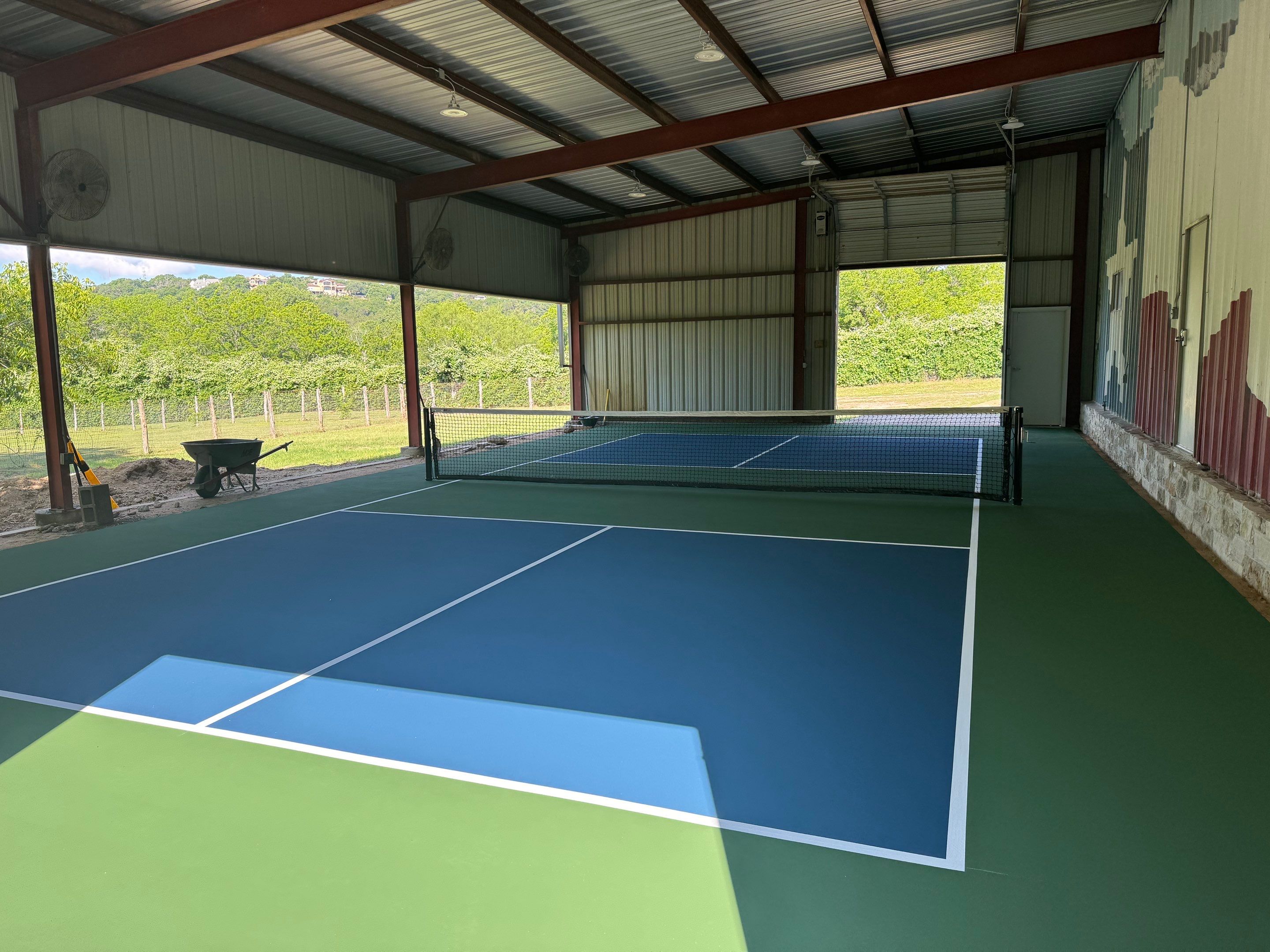 Pickleball Court in Barn on Lake Austin by Sport Court Austin