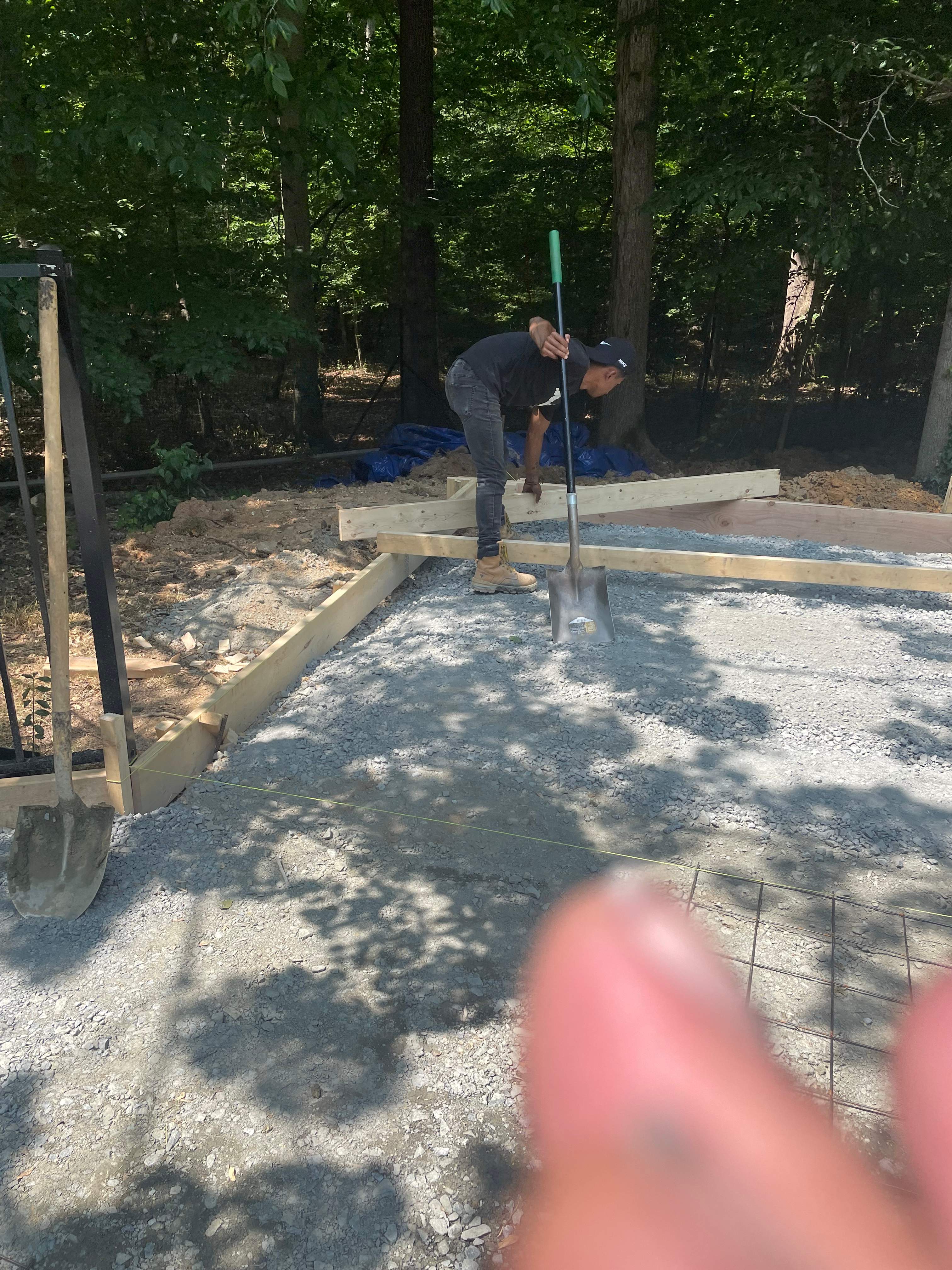 Pool Surround remodel with retaining walls, new waterfall and water slide by Fairfax Contractors, LLC