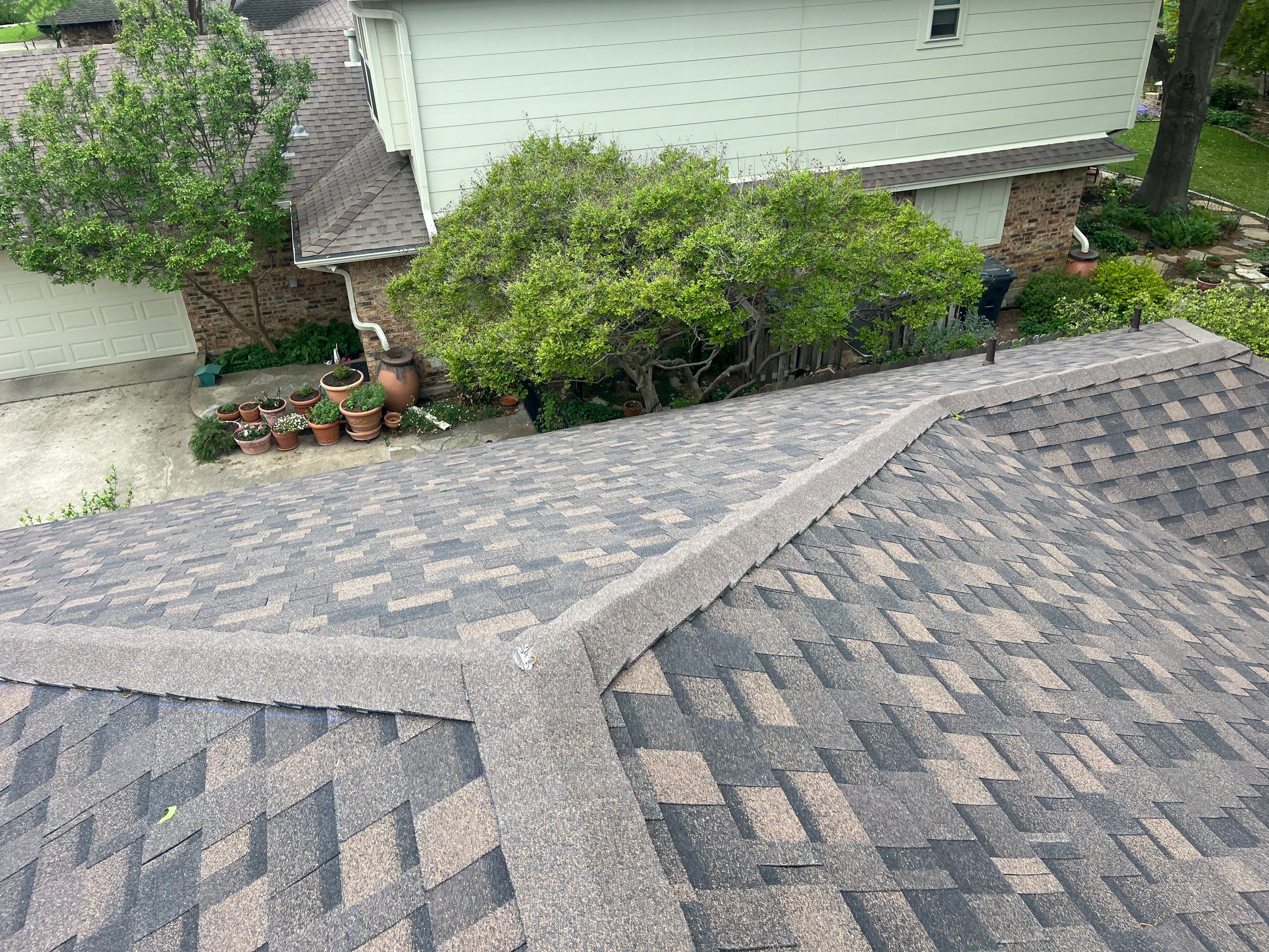 Brown brick with IKO Shadow Brown by Tejas Roofworks + Restoration