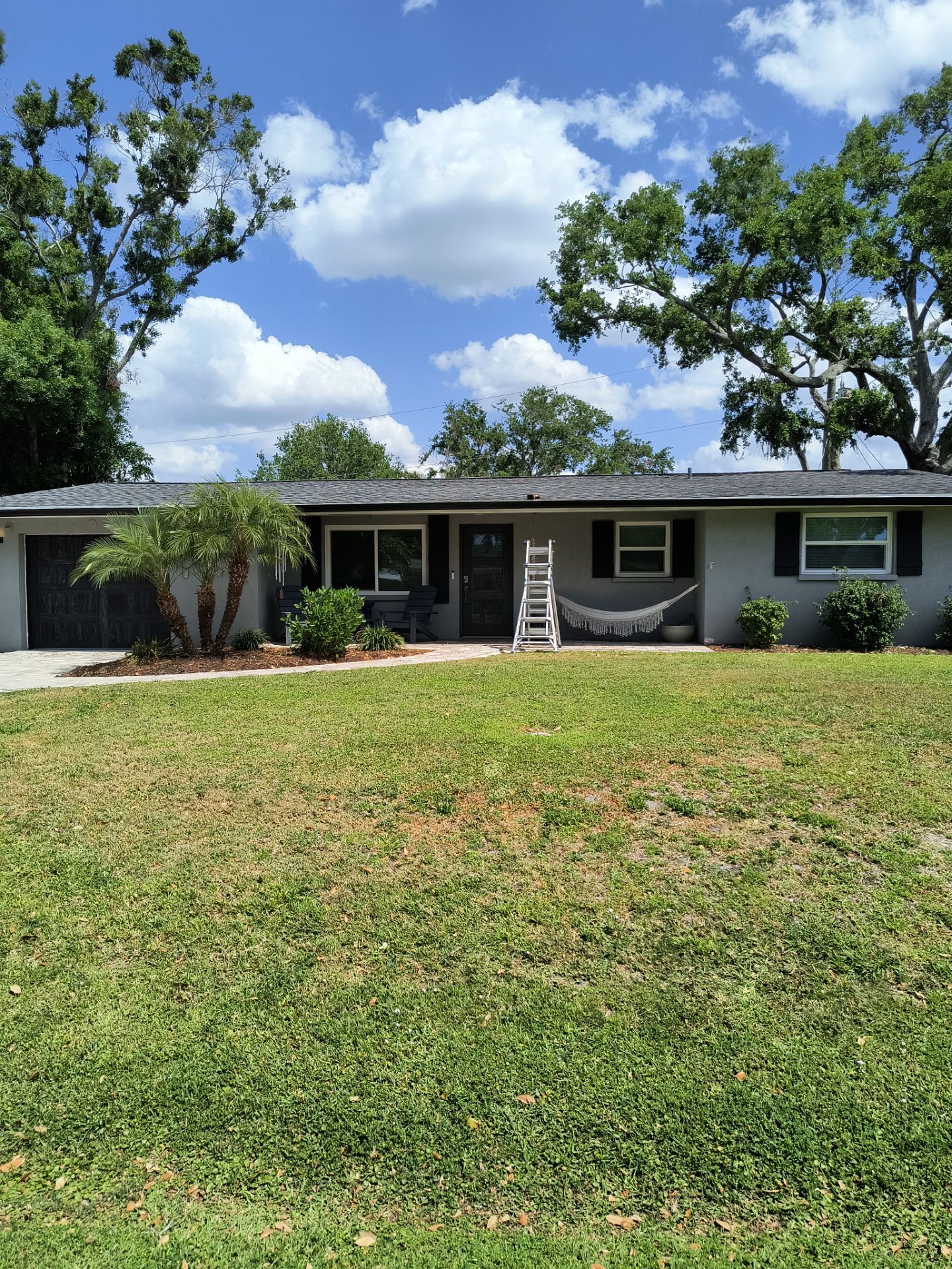 Black Seamless Gutters using 7 inch seamless gutters & New White Soffit in Sarasota FL by Gutter Professors
