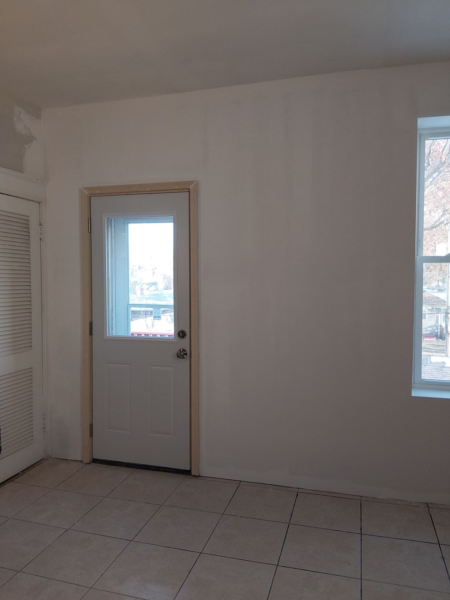 Rear Door Replacement and Kitchen Wall Restoration – St. Louis, MO by Legendary Services Company LLC.