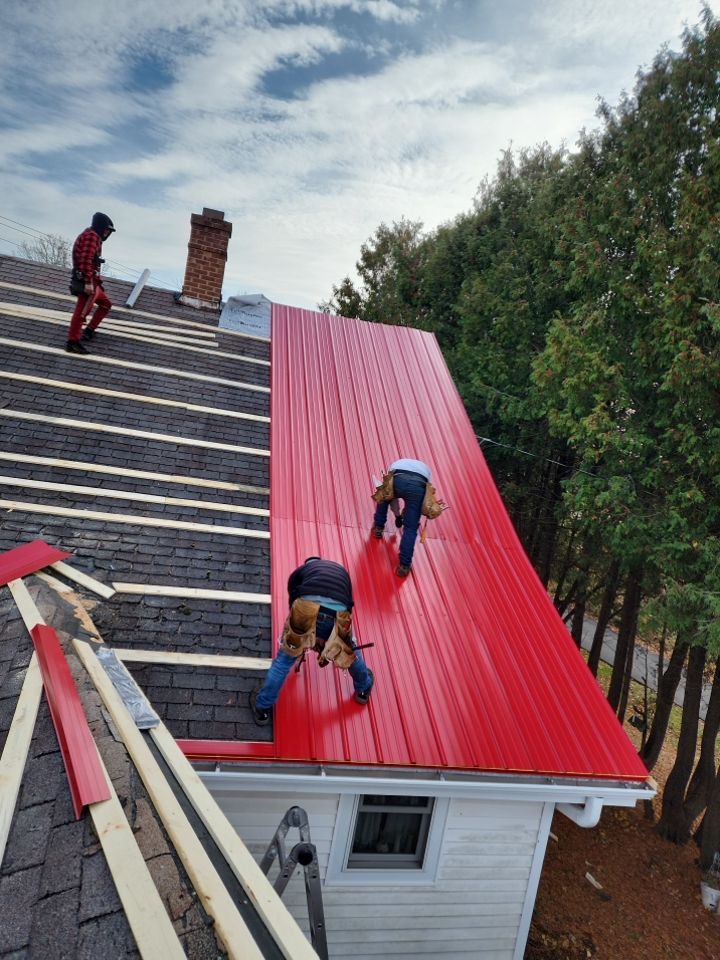 Residential Roof Installation with Red Pro Rib Metal Roofing in Adell, WI by Gellings Roofing and Siding LLC