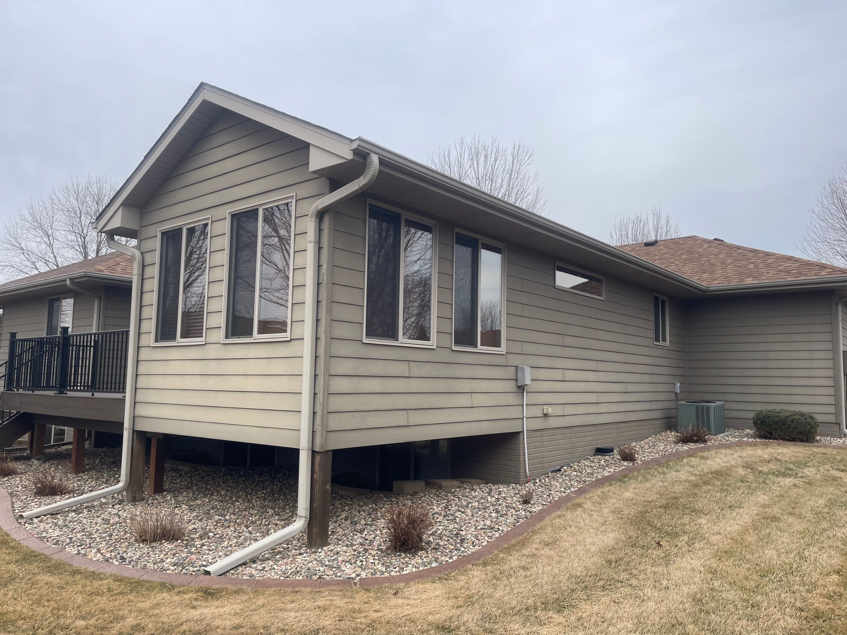 Residential Exterior Siding and Trim Painting in Sioux Falls by Select Painting, Coatings & Garage Cabinets