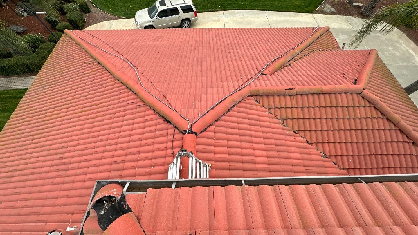 Tile refurbish project using existing tiles and replaced underlayment and battens by Straight Edge Roofing Inc