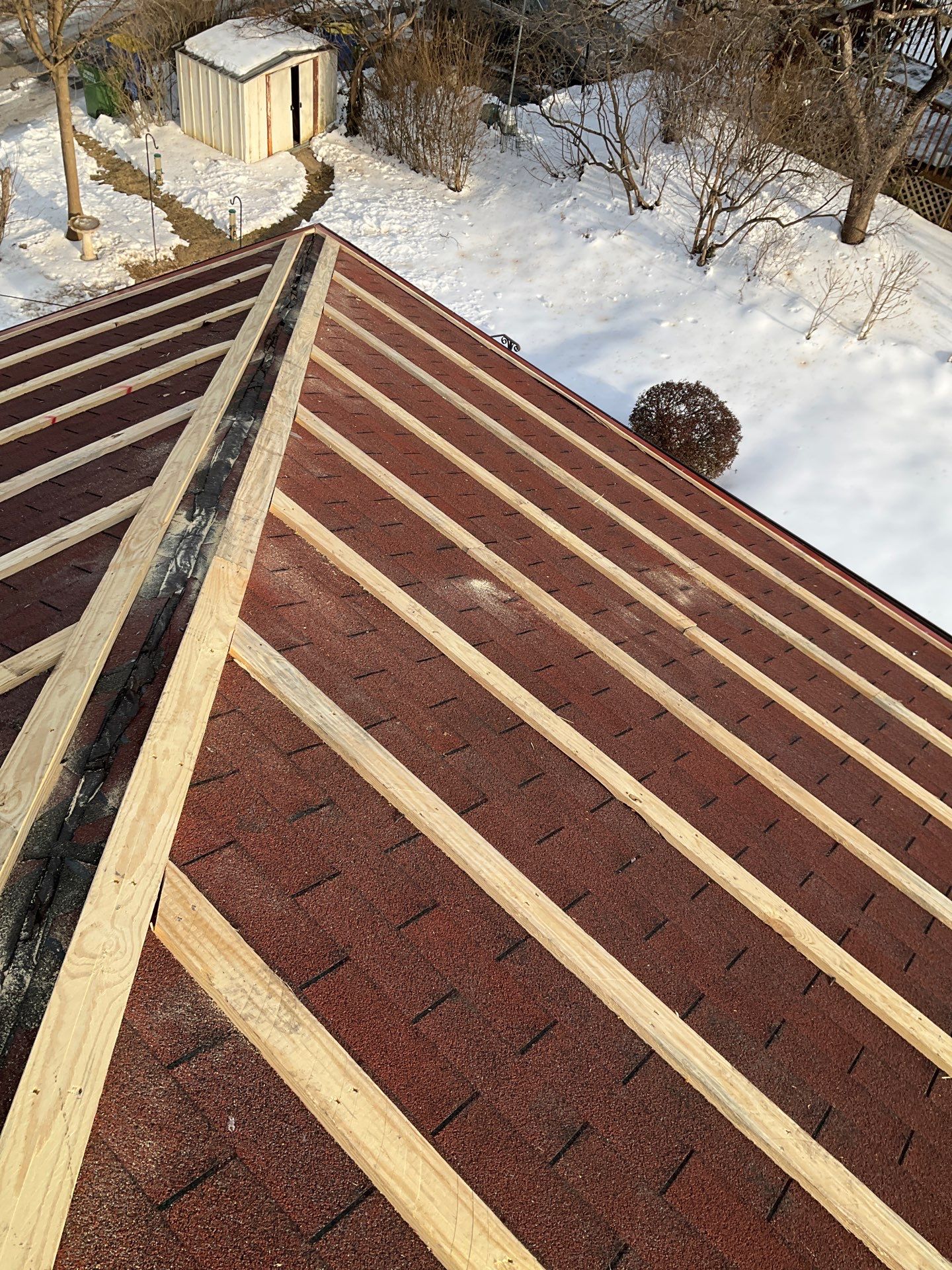 Red Metal Roofing Upgrade for Brick Home by Esh Builders