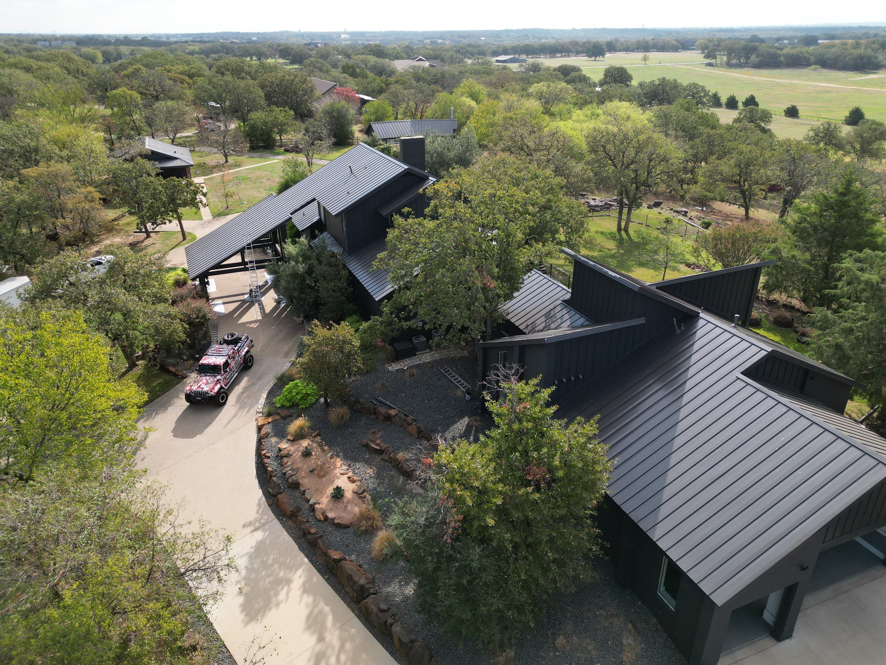 Dark Bronze Standing Seam Metal Roof by First Out Roofing 
