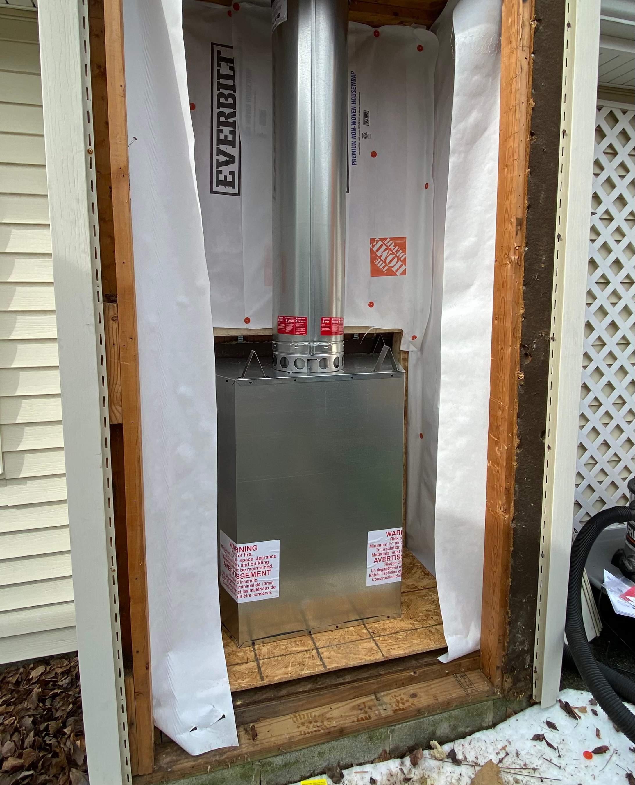 Wood Prefab Fireplace Replacement in Virginia Beach by Premier Chimney and Roofing