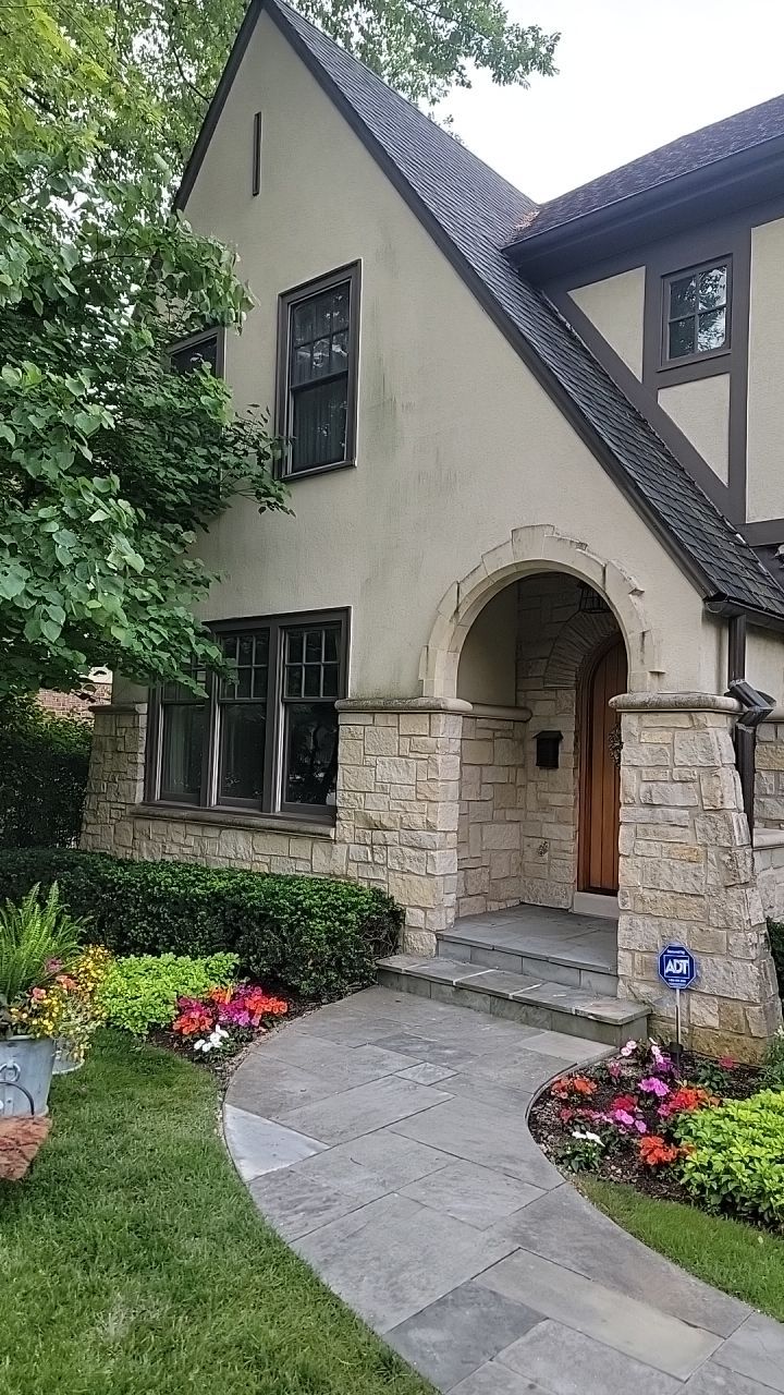 Northbrook, IL stucco home soft wash and stone cleaning by Northern Power Washing LLC.