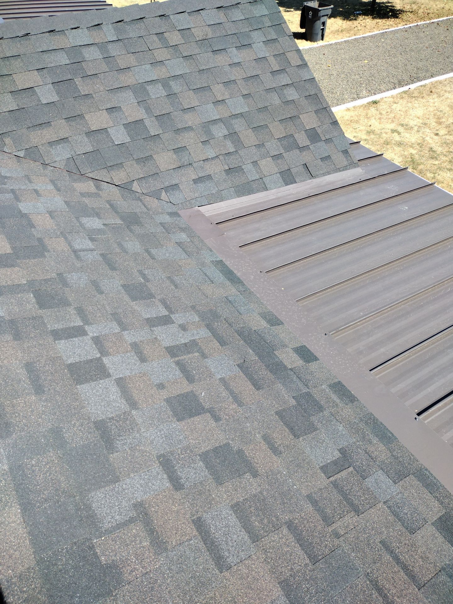 Residential Roof Replacement with Metal Accents by Orezona Building & Roofing Company, Inc.