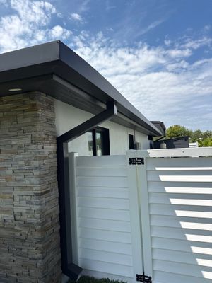 7-Inch Smooth Box Seamless Gutters using black seamless gutters in Siesta Key Fl