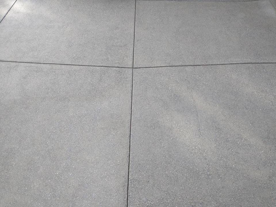 Cristi | Sand Finish Concrete Driveway  by Jireh Asphalt & Concrete Inc 
