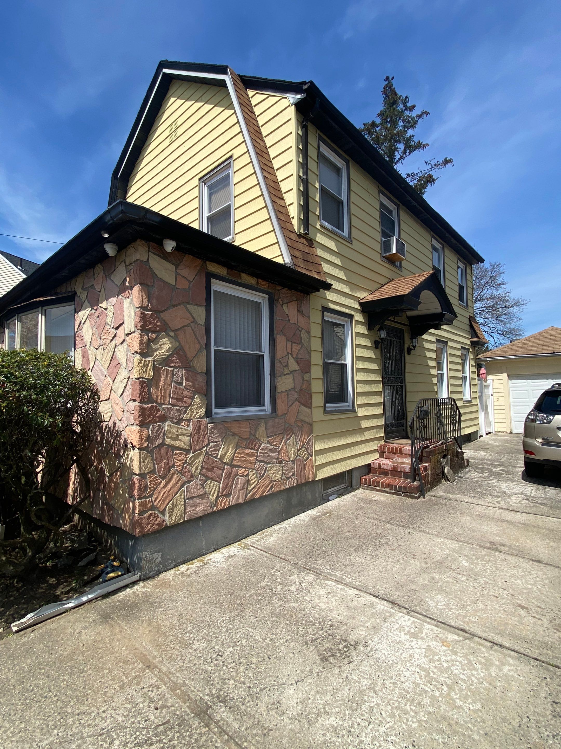 Full House Installation 5" black seamless gutters and 2x3 leaders using 5" black K style seamless gutters and 2x3 black leaders by Above All Gutters
