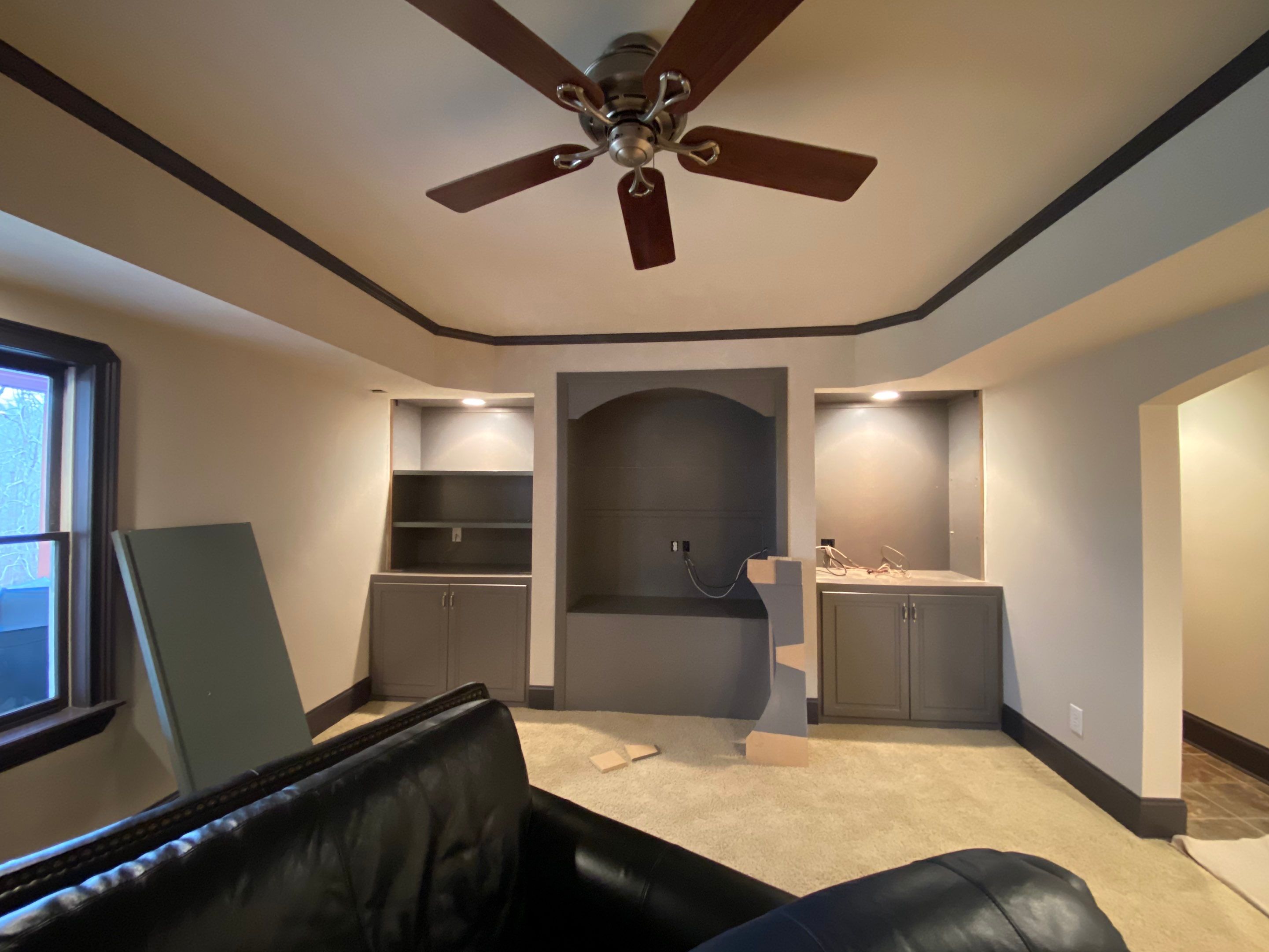 Finished Basement Renovation with Custom Shiplap and Modernized Wood Railings by Swift Home Renovations 