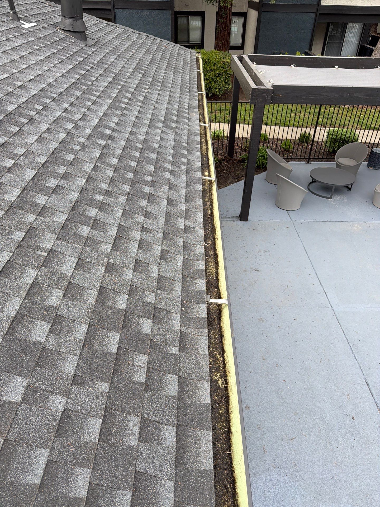 HOA gutter cleaning in Napa, CA, after  photo showing full gutters.