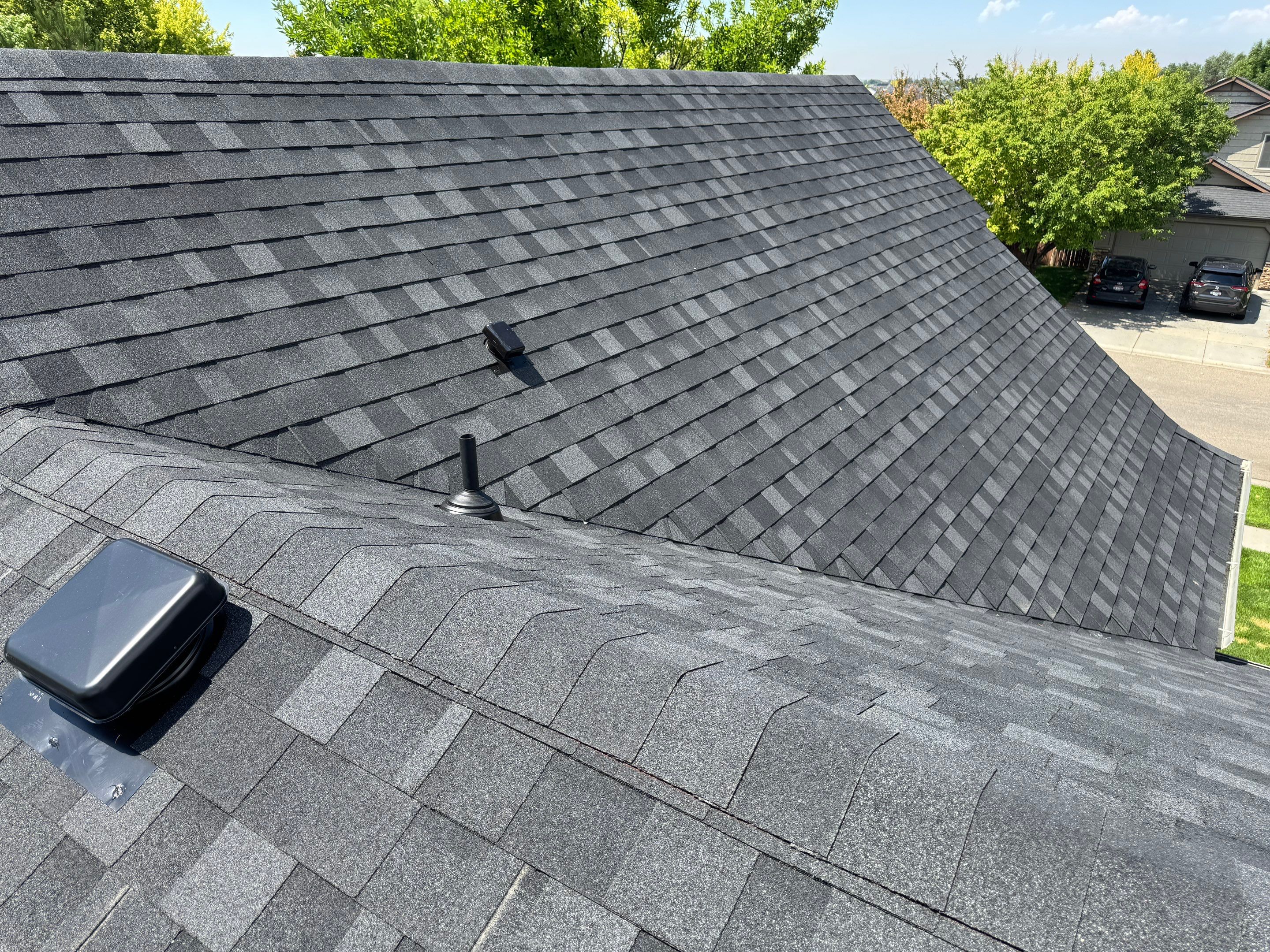 Residential Roof Replacement Featuring Charcoal Grey Architectural Shingles by Olive Roofing