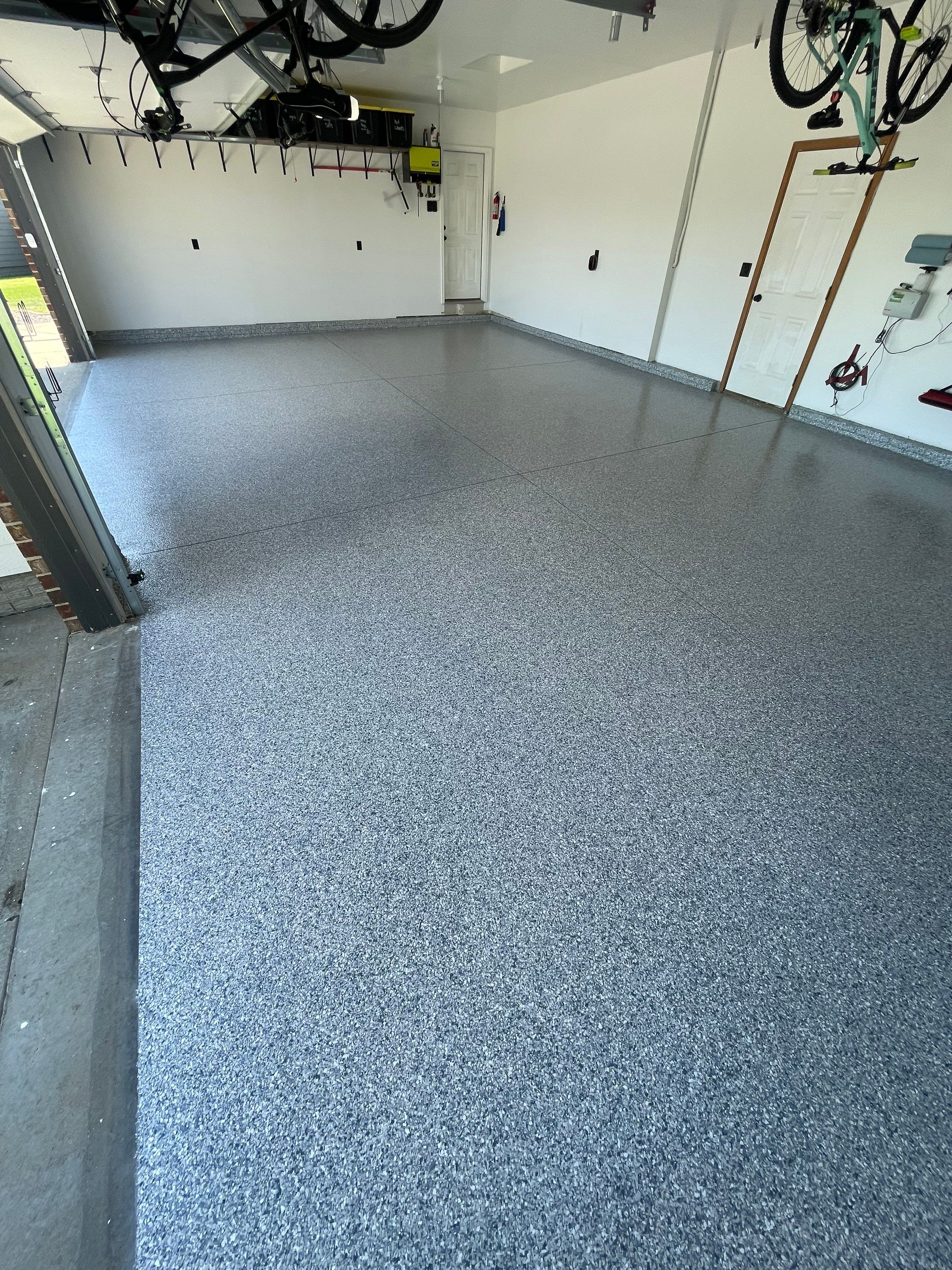 Tidal Wave Flake Garage Floor Installation in Sioux Falls by Select Painting, Coatings & Garage Cabinets